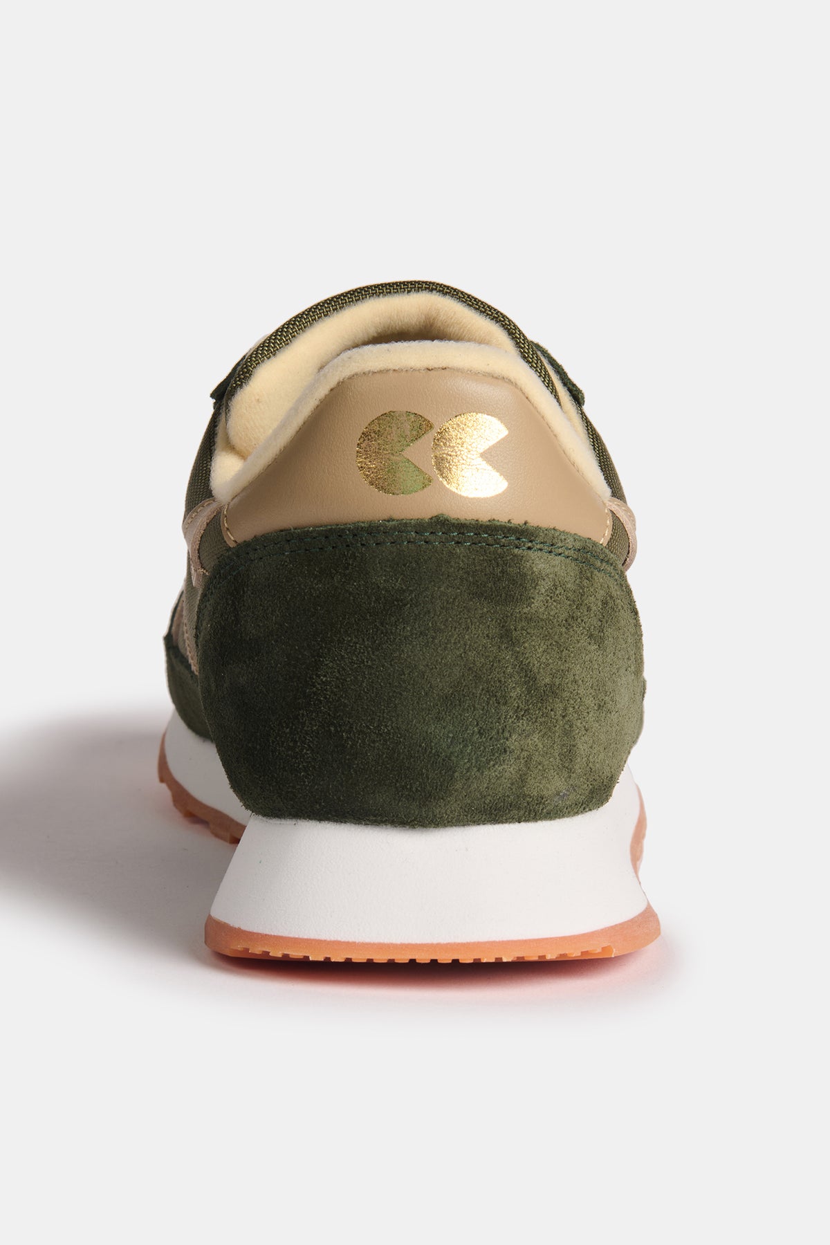 The heal of Community Clothing X Walsh Beacon trainer with gold CC logo foil on the heal