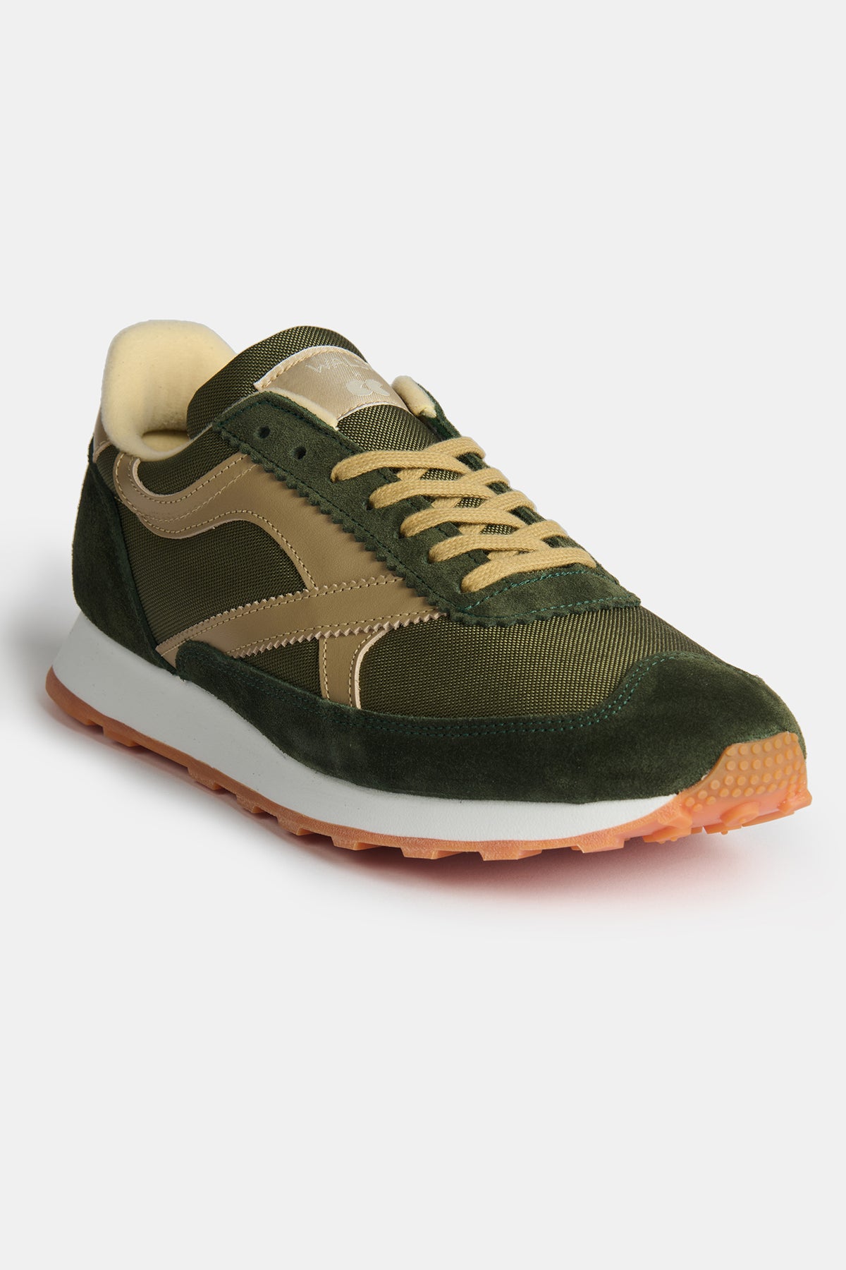 Flatlay of Community Clothing X Walsh Beacon trainer in dark olive and beige