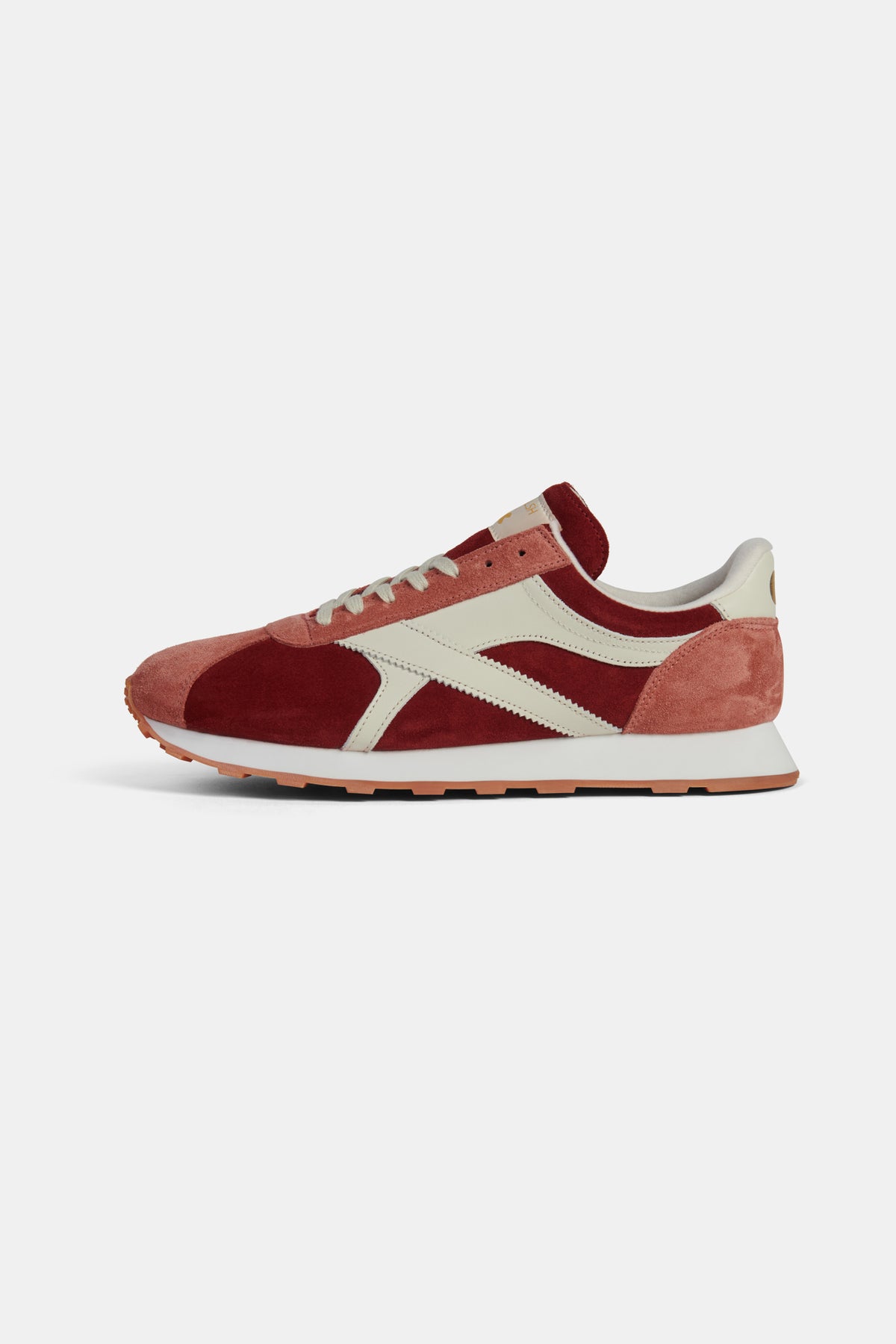 Red and white trainer on a white background.