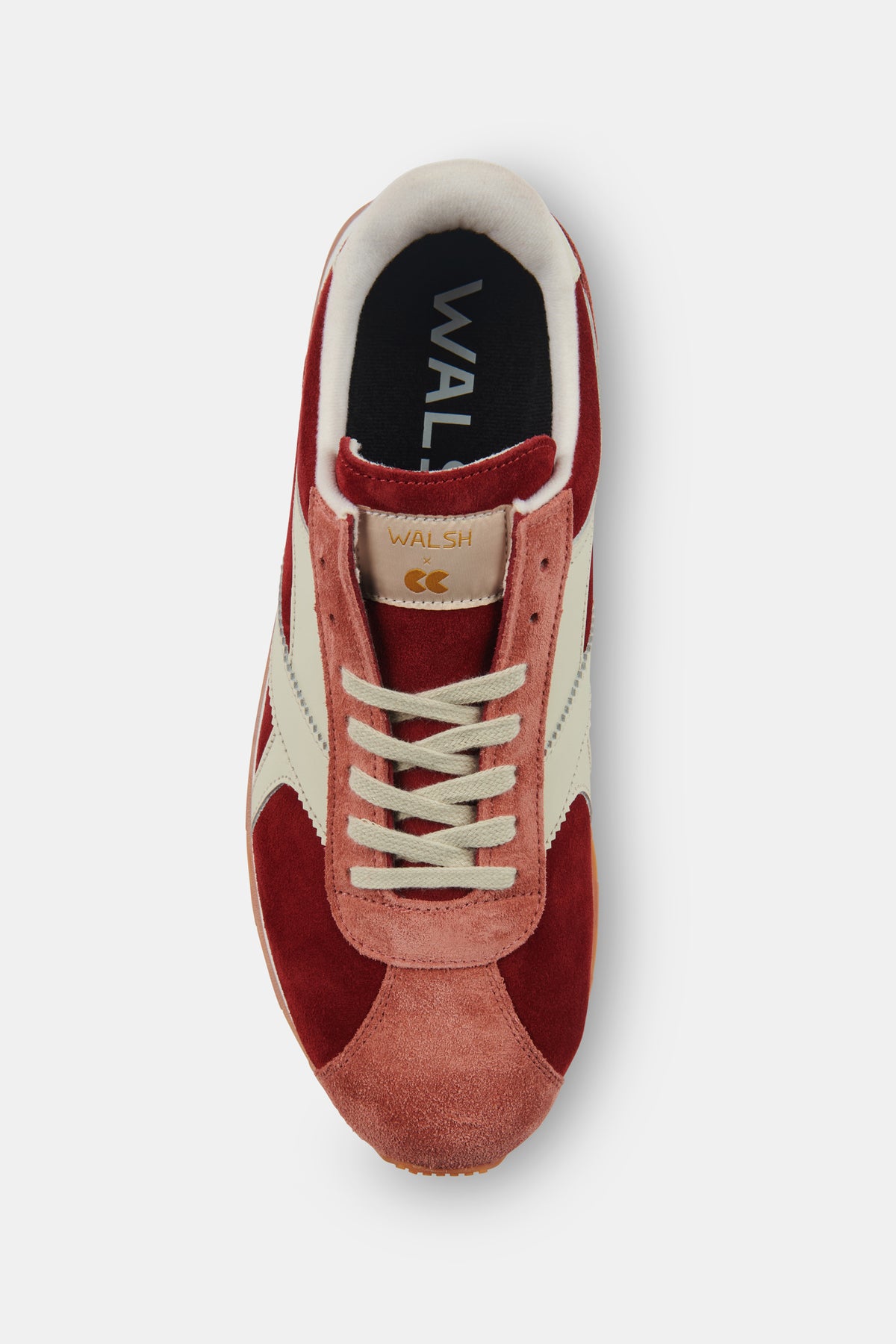 Red and white trainer with visible brand logo on a white background