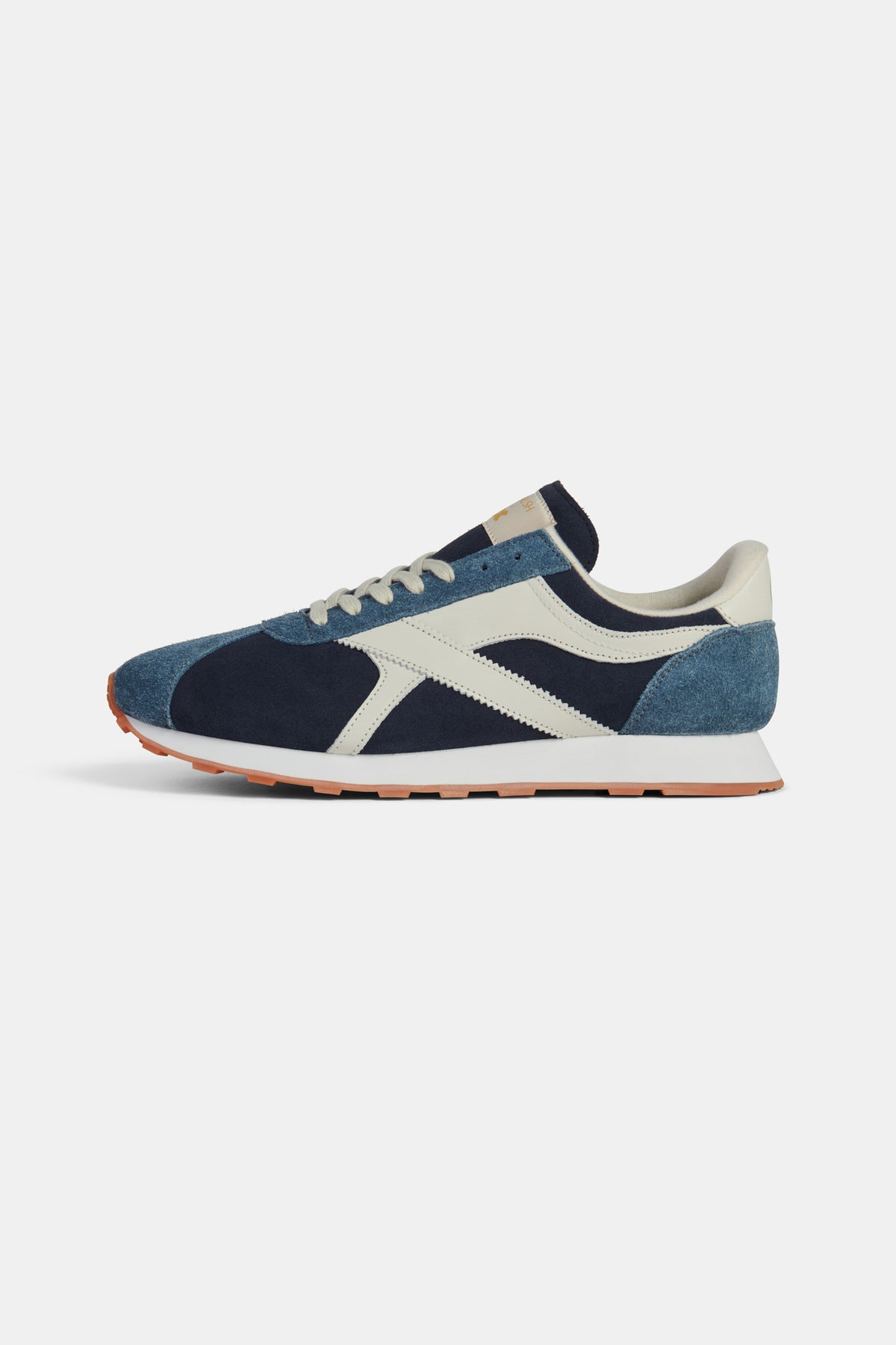 Navy and beige sneaker on a white background