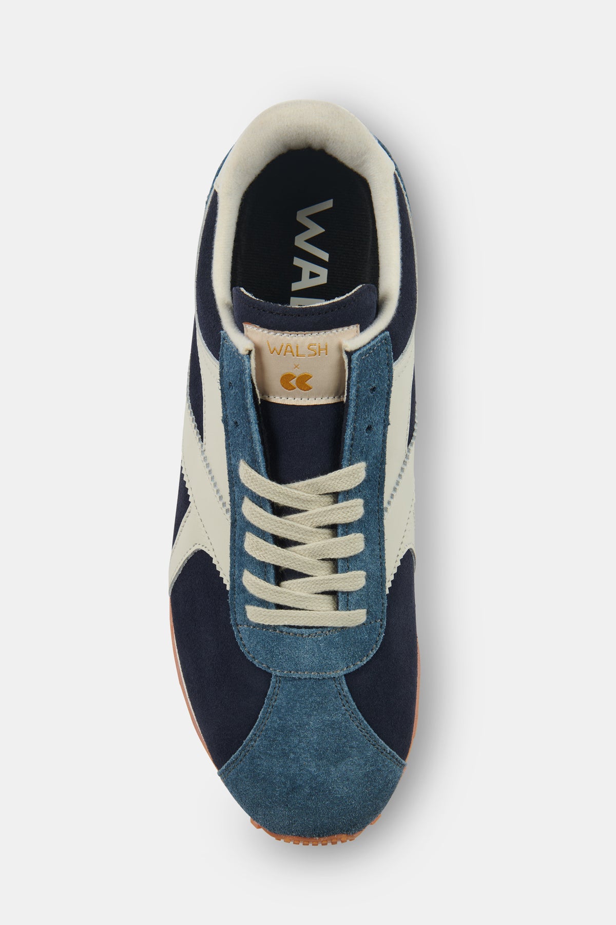 Navy and white trainer with branding on a white background.