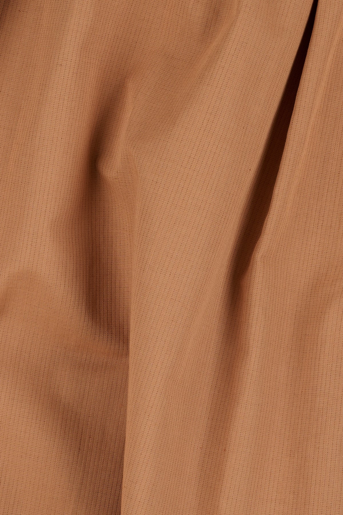 Close-up of cinnamon fabric.