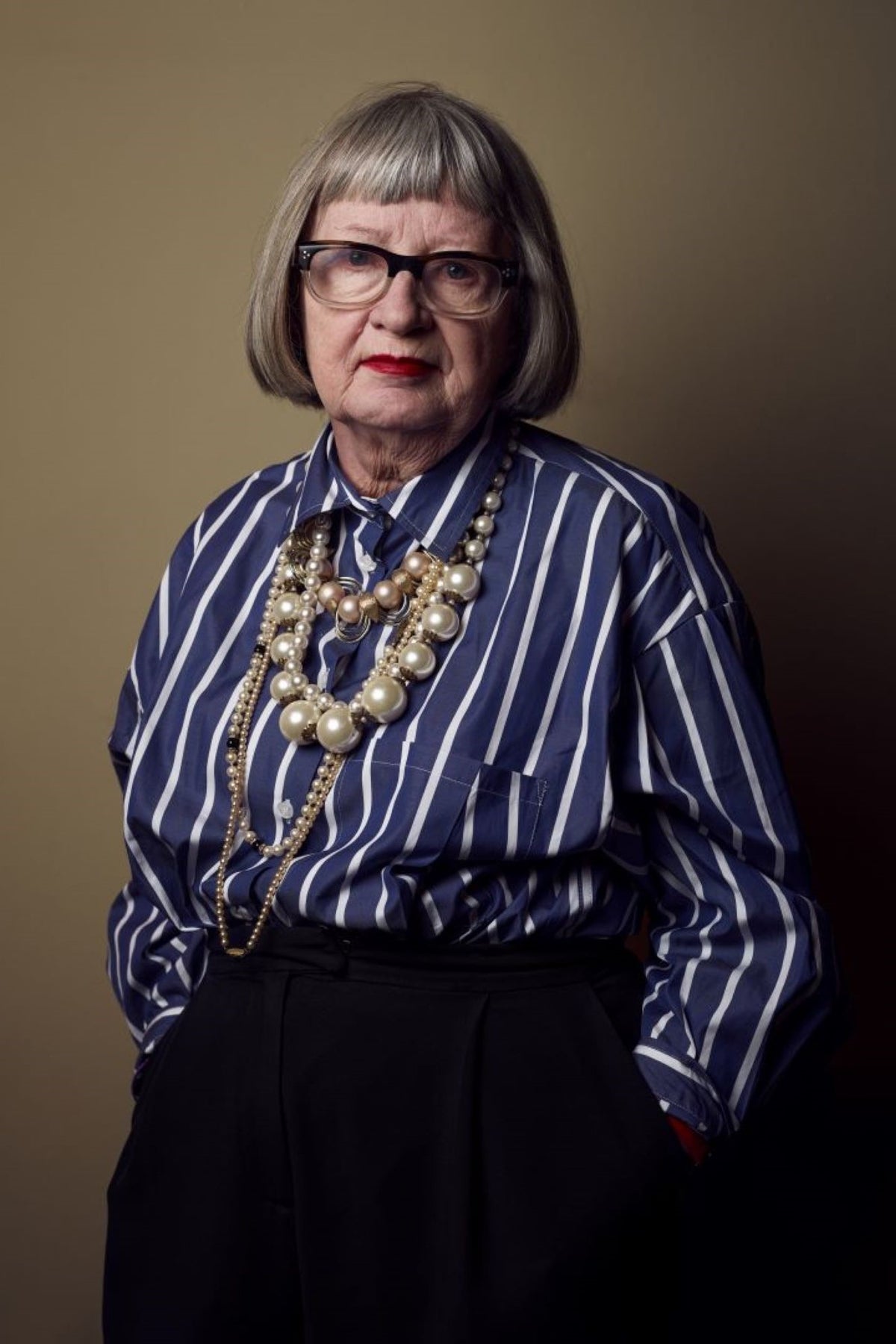 Esme Young Wearing a Navy and white stripe long sleeve shirt from community clothing