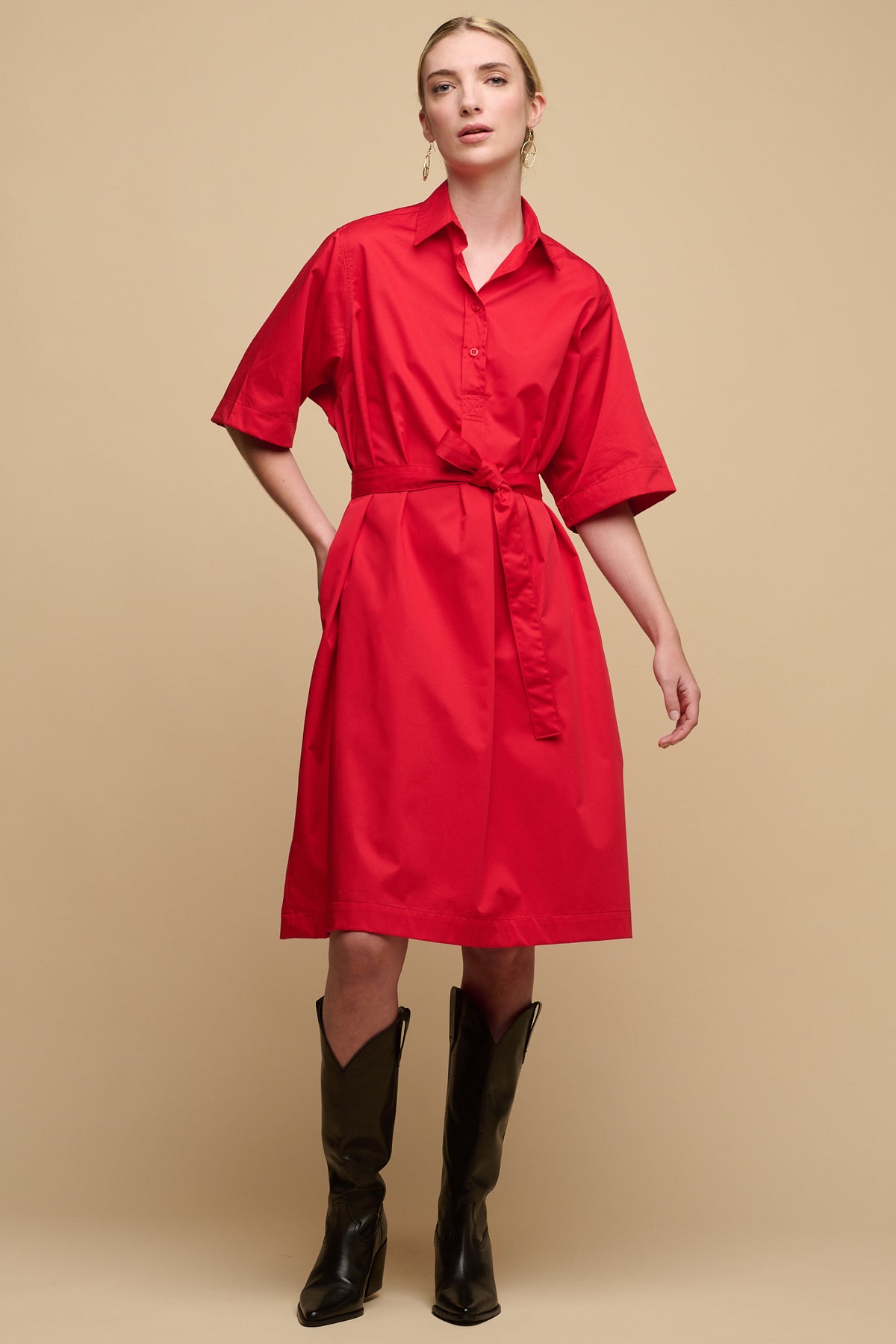 Full body image of the front of female wearing cotton collared dress straight red with waist belt tie and 3/4 sleeves