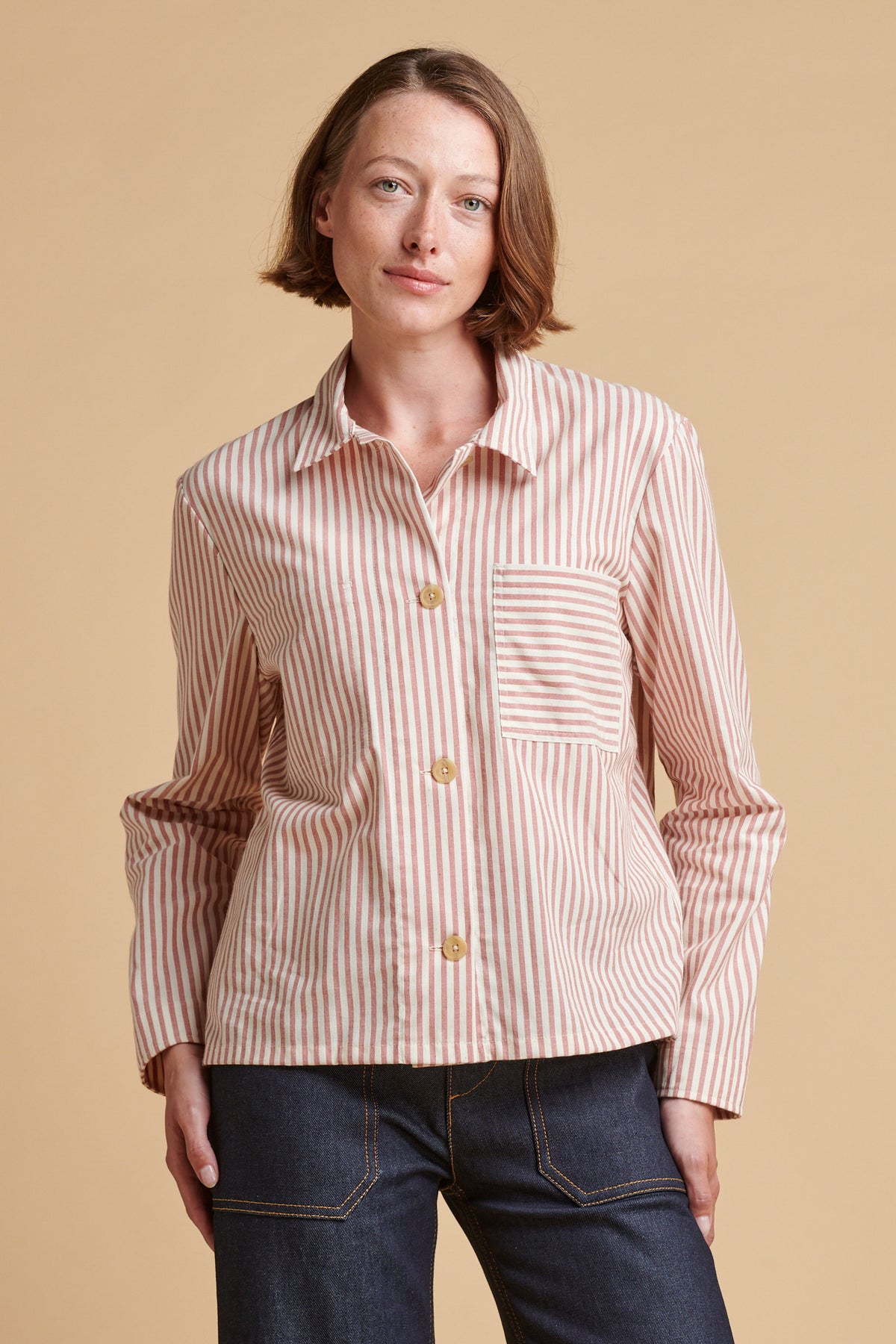 Female wearing Elena stripe overshirt in red white.