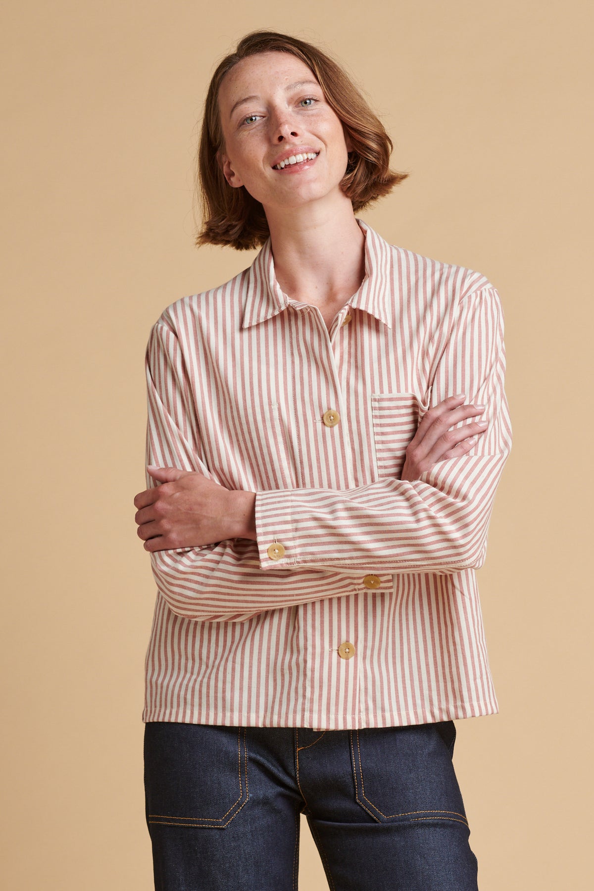 Female wearing Elena stripe overshirt in red white.