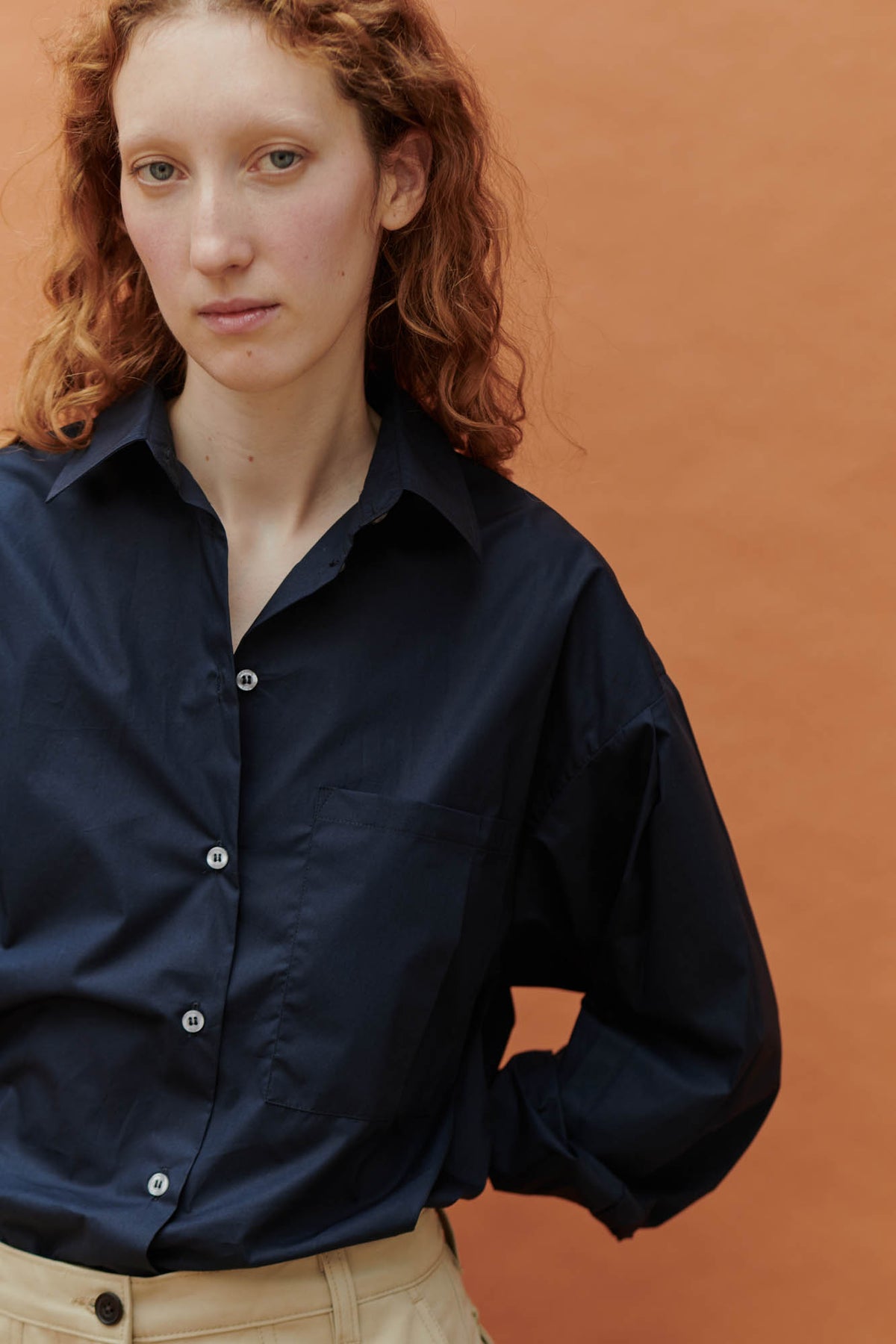 female wearing esme long sleeve shirt navy