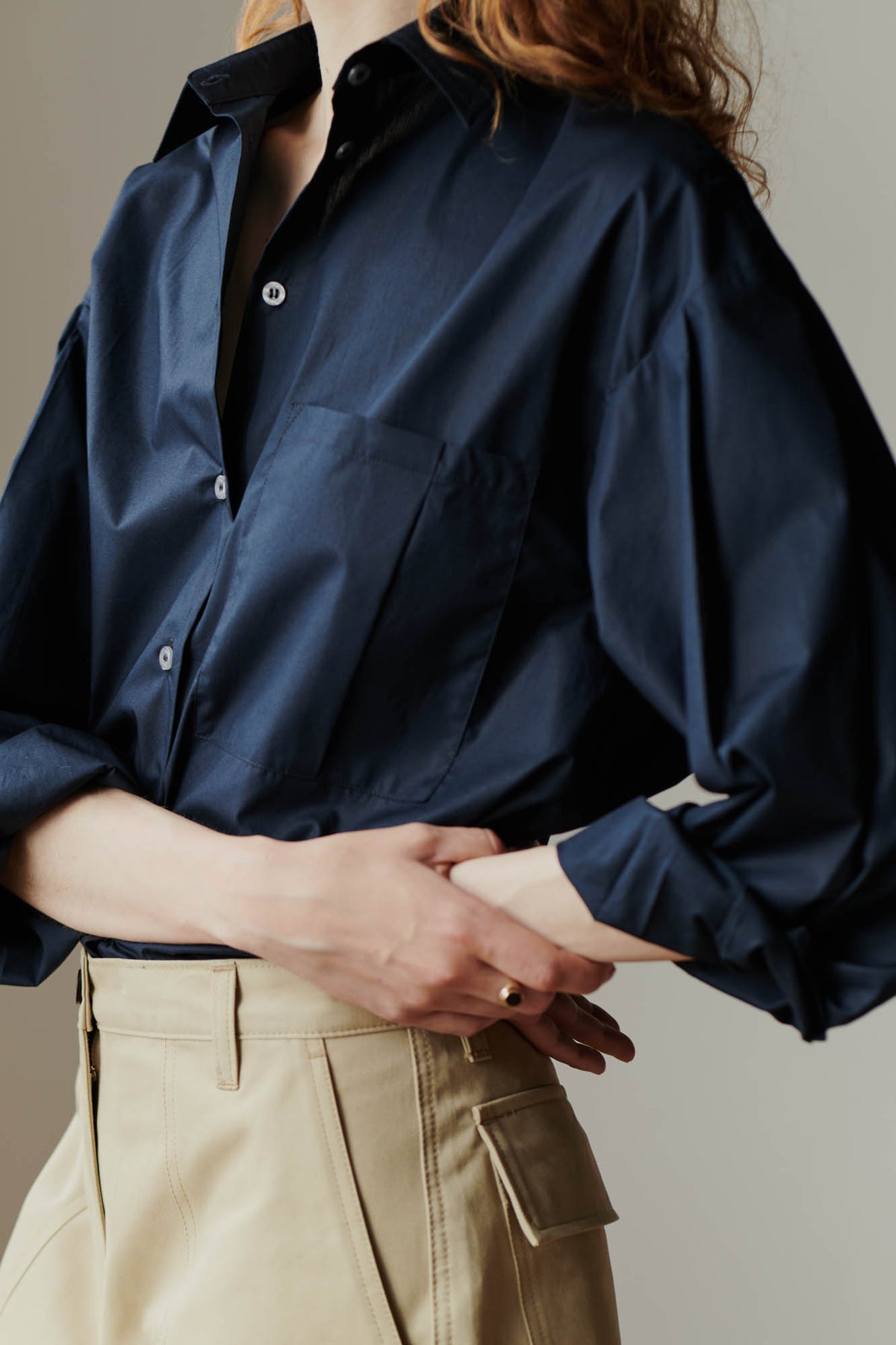 close up side angle detail shot of the esme long sleeve shirt in navy