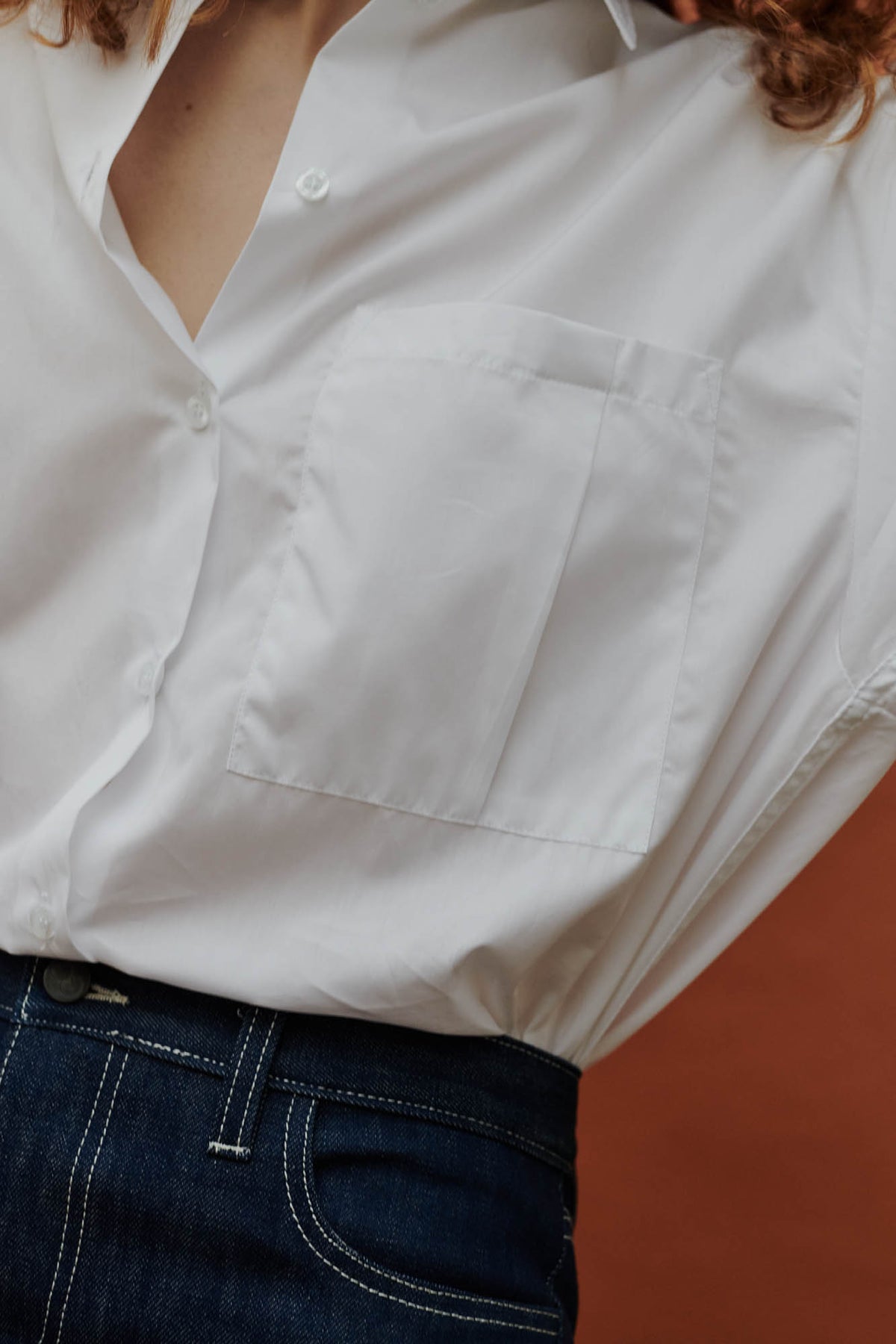 close up pocket detail shot of the white esme long sleeved shirt