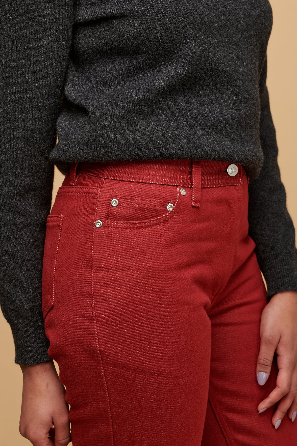 Close up of the front of women's Gloria jean with three front pockets including coin pocket and silver rivets, CC logo button fastening 