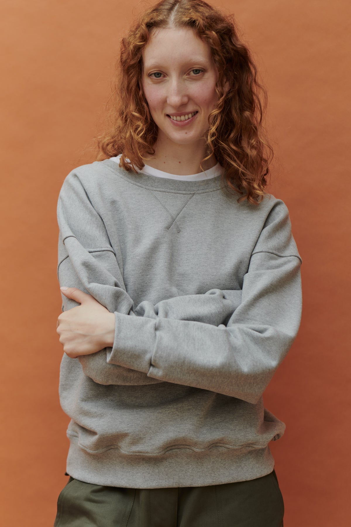front of female wearing heritage sweatshirt in navy