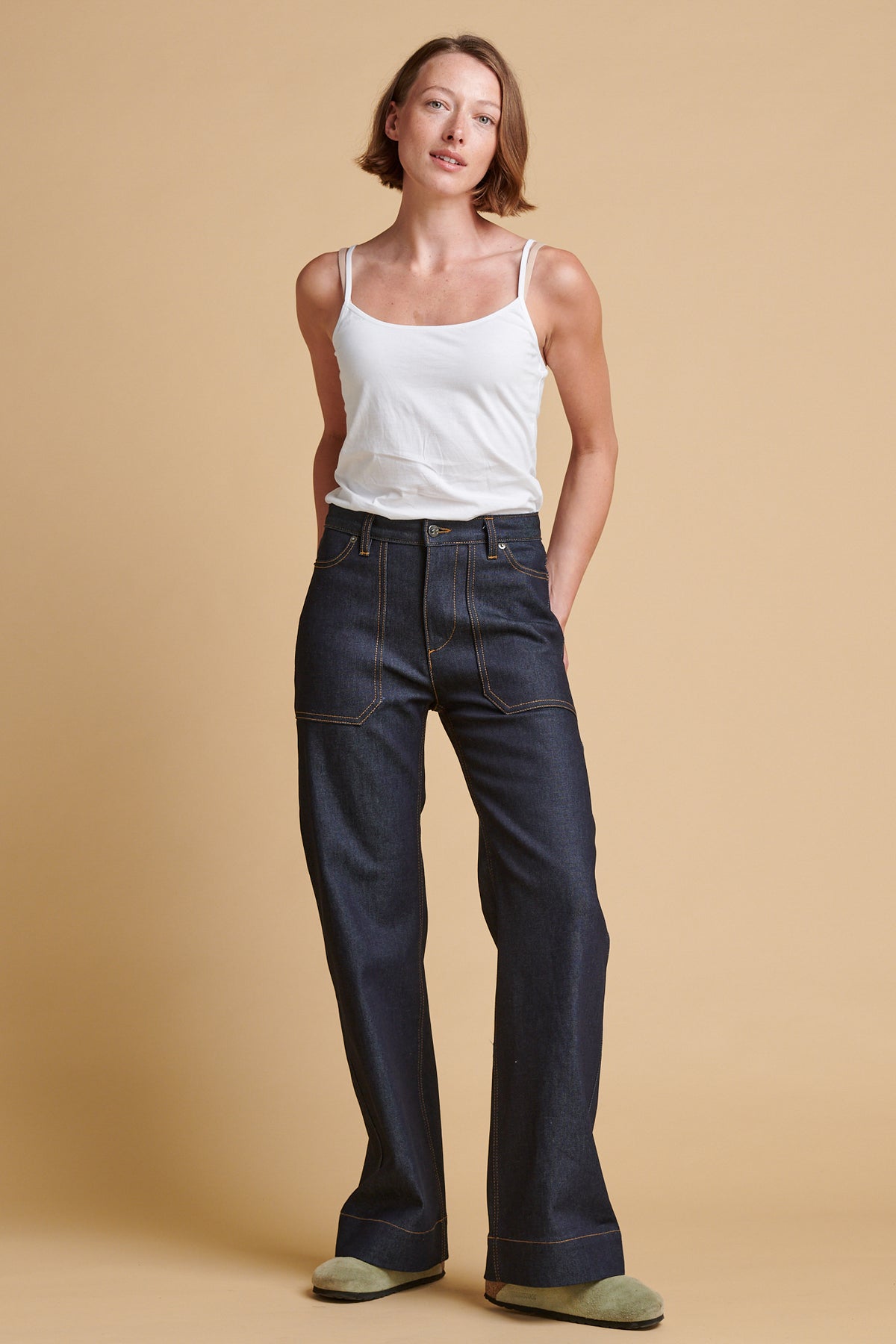 Female wearing high rise wide leg Linda jean.
