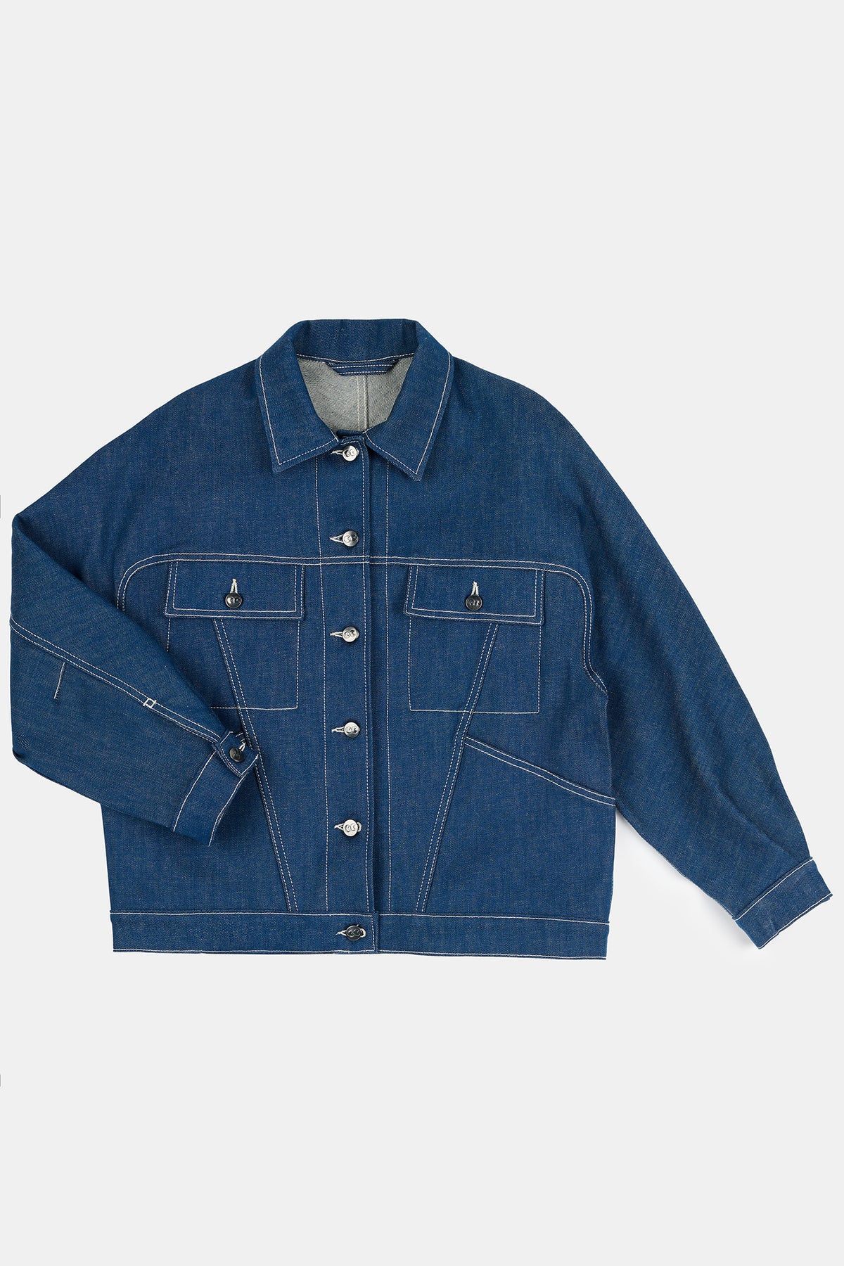 Flatlay product image of women's Jodie denim jacket in blue with white contrast stitching