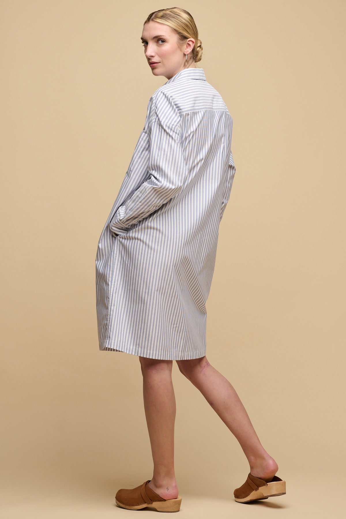 full body image of the back of female wearing Lorelle shirt dress without the belt 