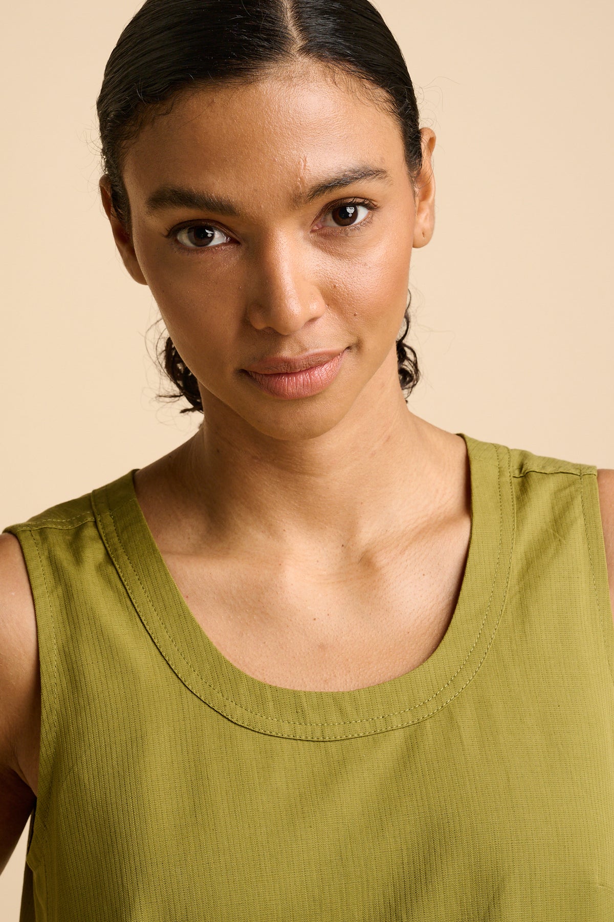 Portrait of woman in green dress.
