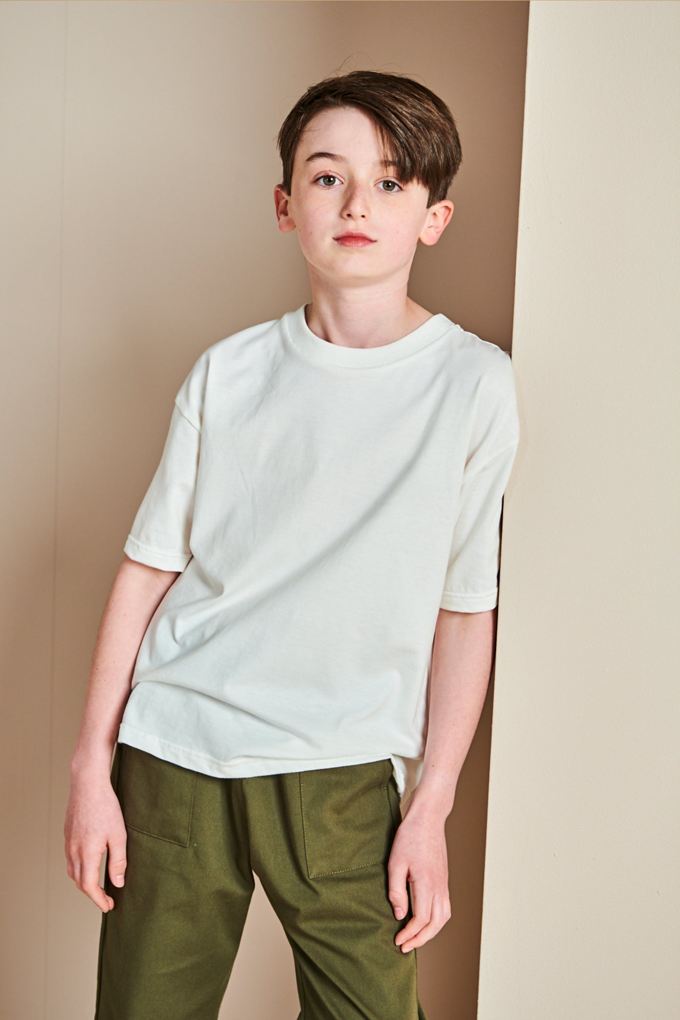 Young girl wearing plastic free short sleeve t shirt  in bone 