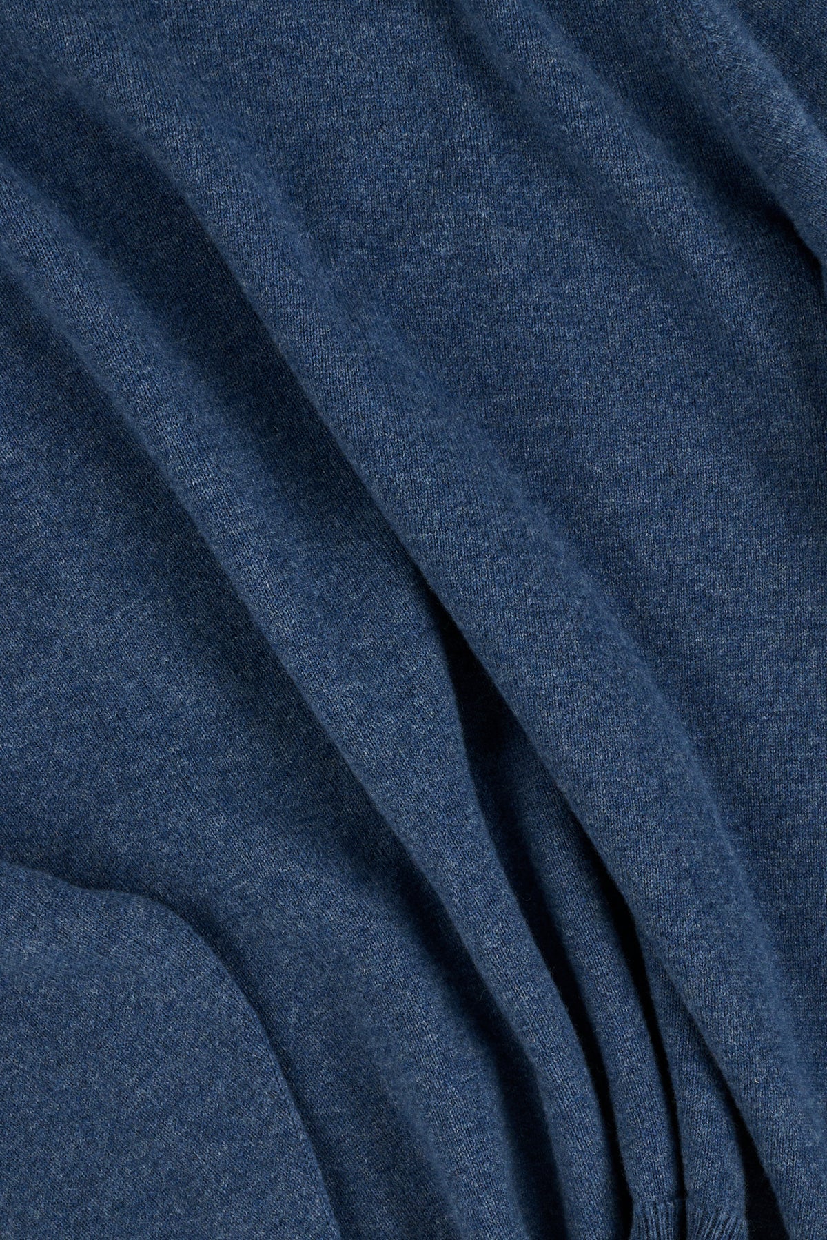 Close up of blue lambswool crew neck knitted sweater.