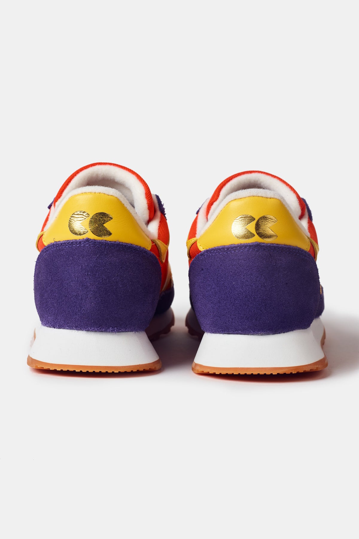 Men's Beacon Trainer in flame red showing purple and yellow heal