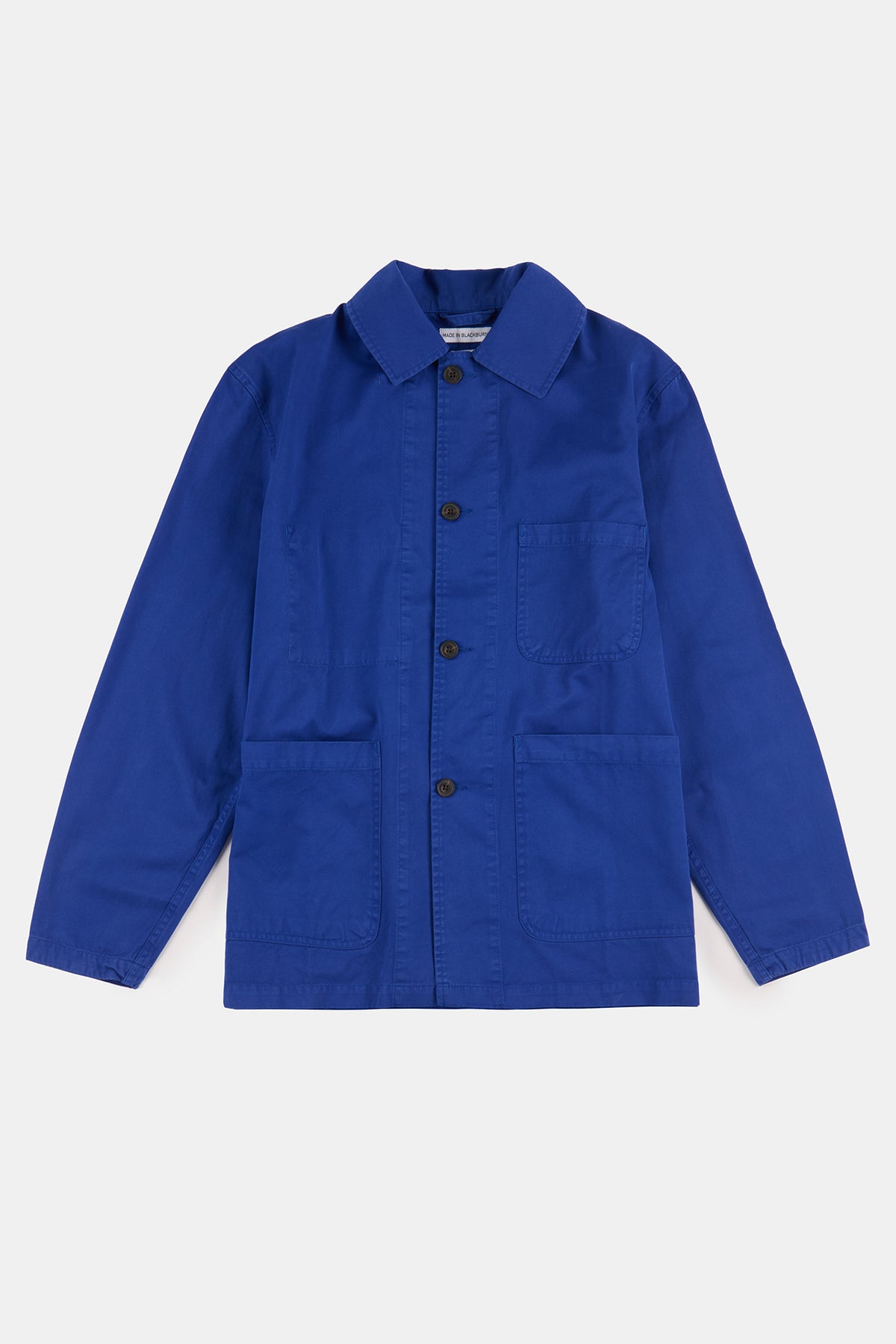 Flatlay product shot of men's chore jacket in washed royal blue