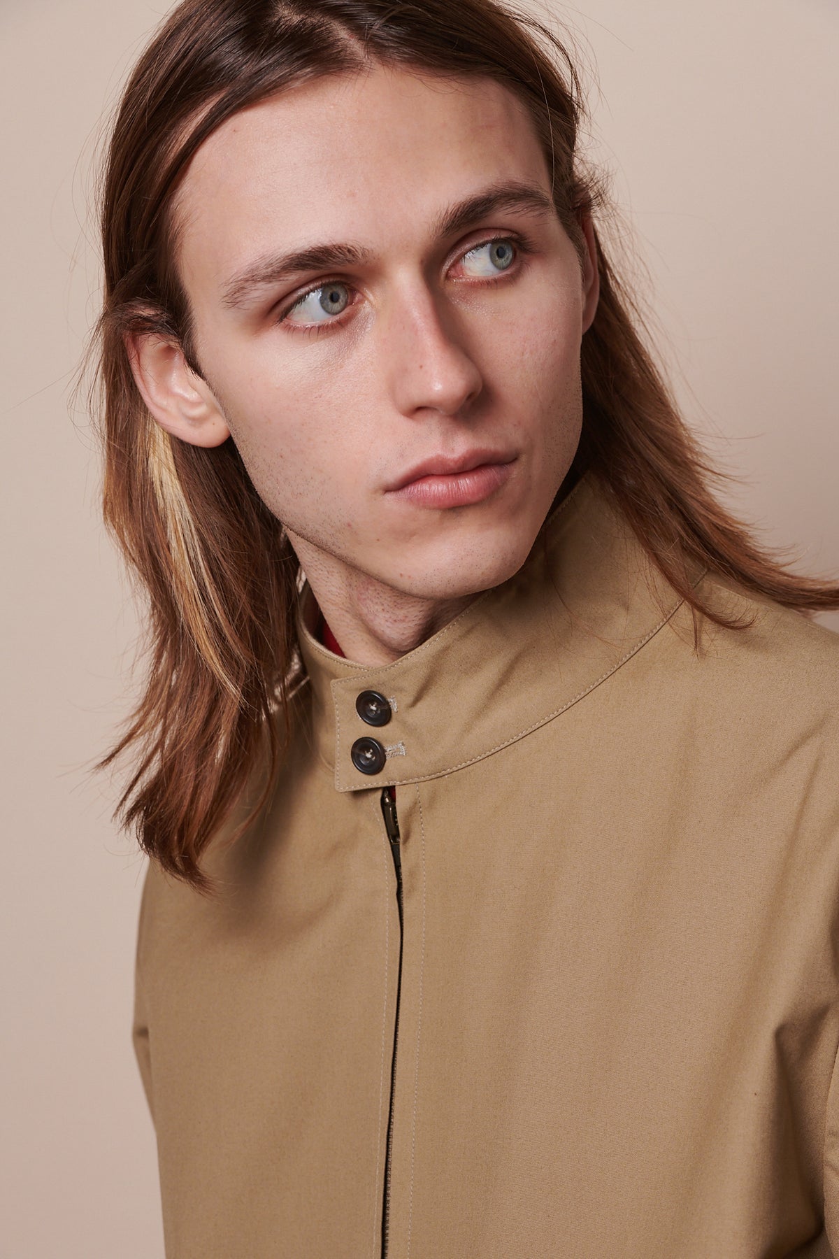 Portrait of male wearing Harrington jacket with collar buttoned