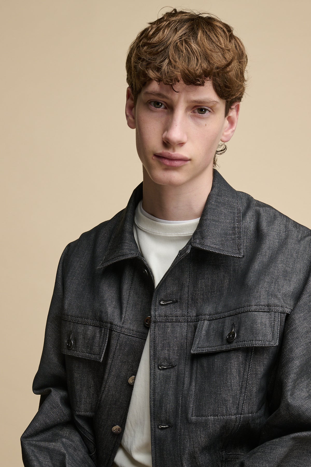 Portrait of white male with orban hair wearing Men's Joe Denim Jacket in Black