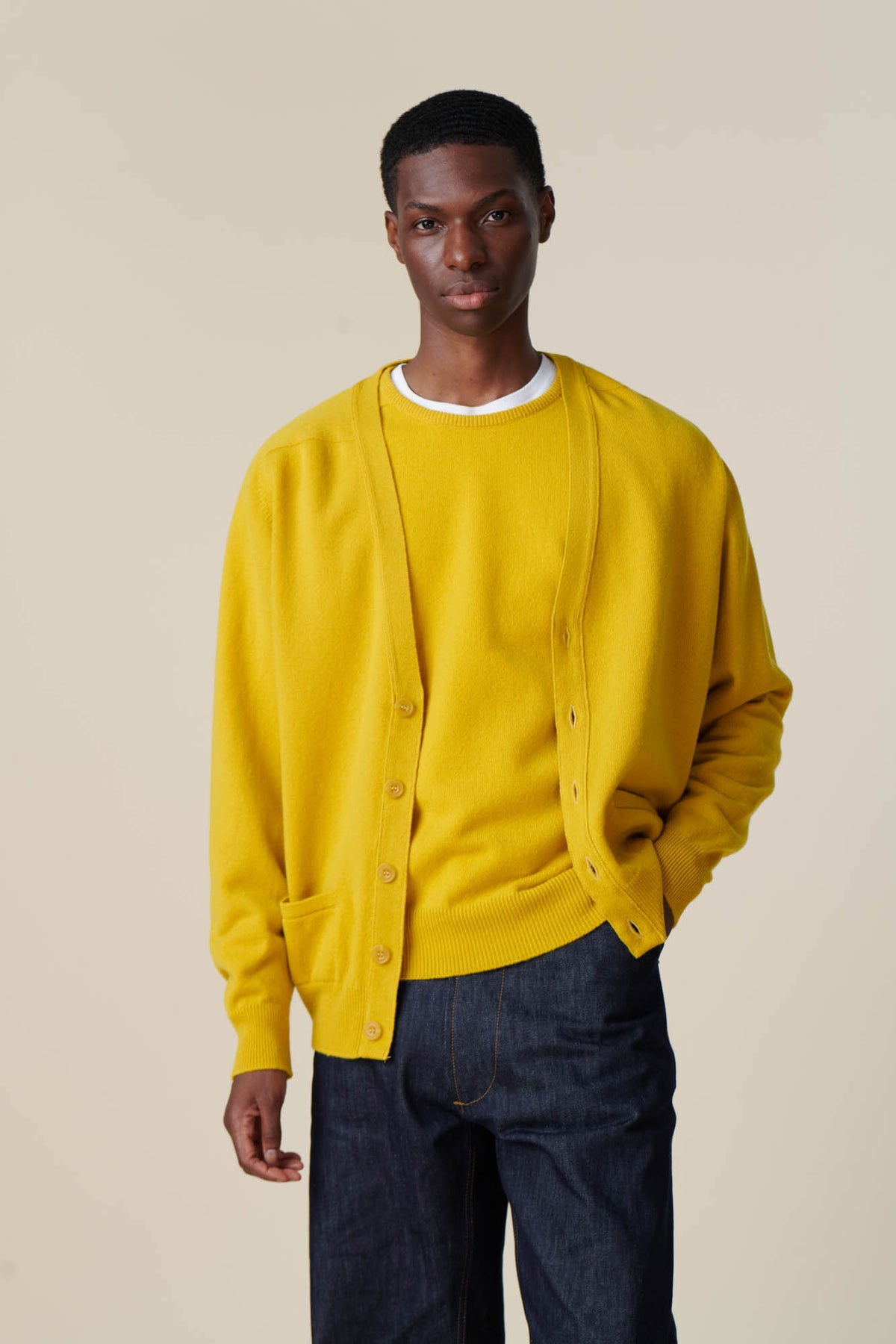 Male wearing lambswool cardigan in picalilli yellow
