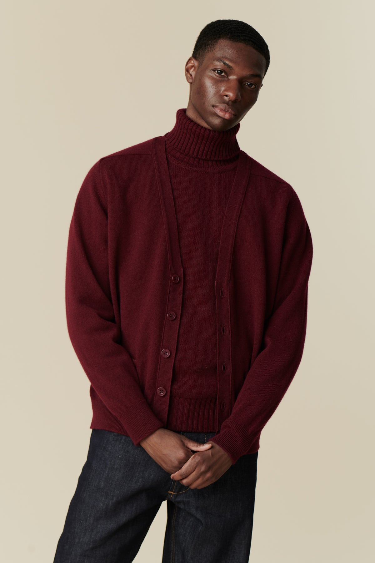 Male wearing lambswool v neck cardigan in burgundy