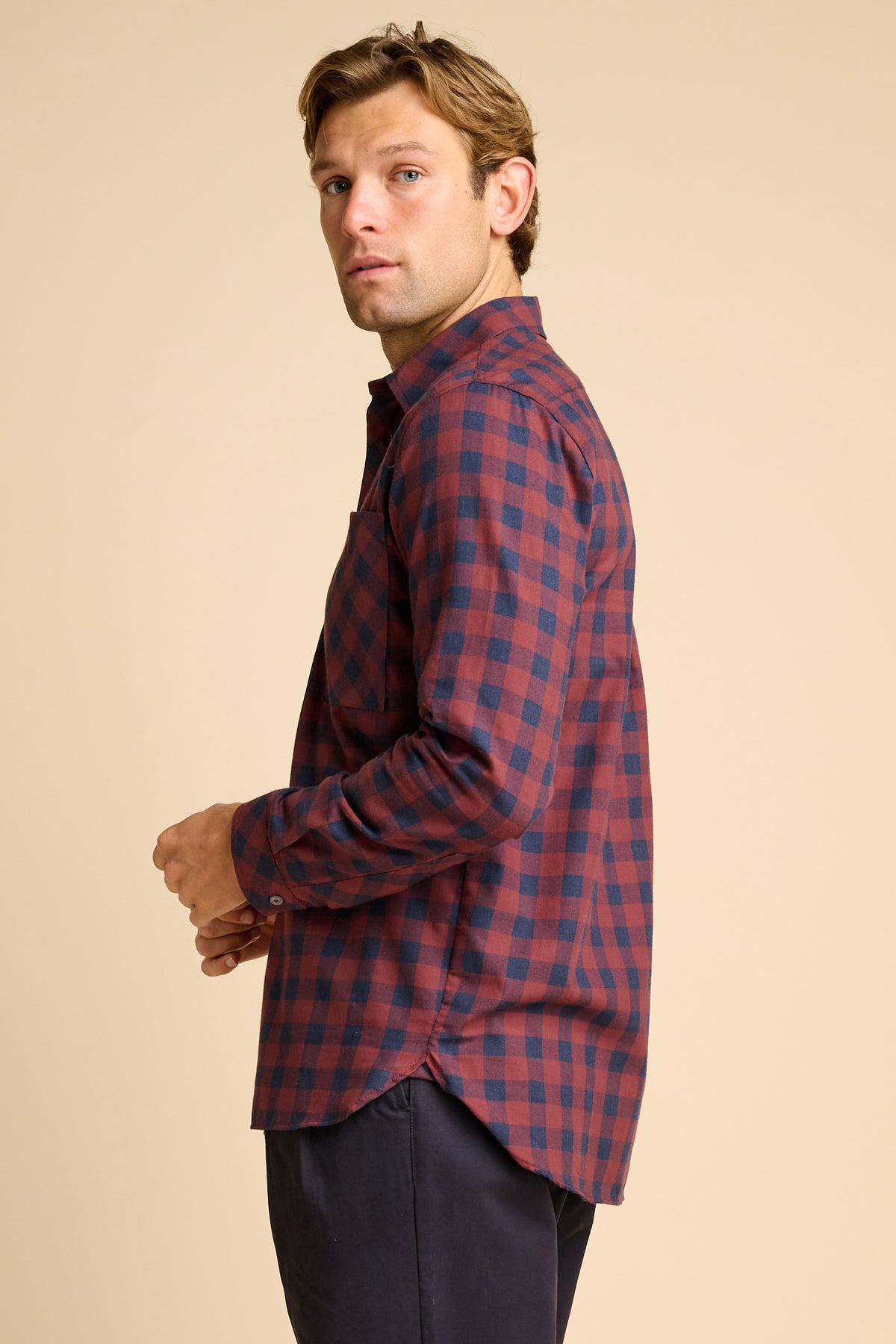 Man wearing red and navy check shirt.