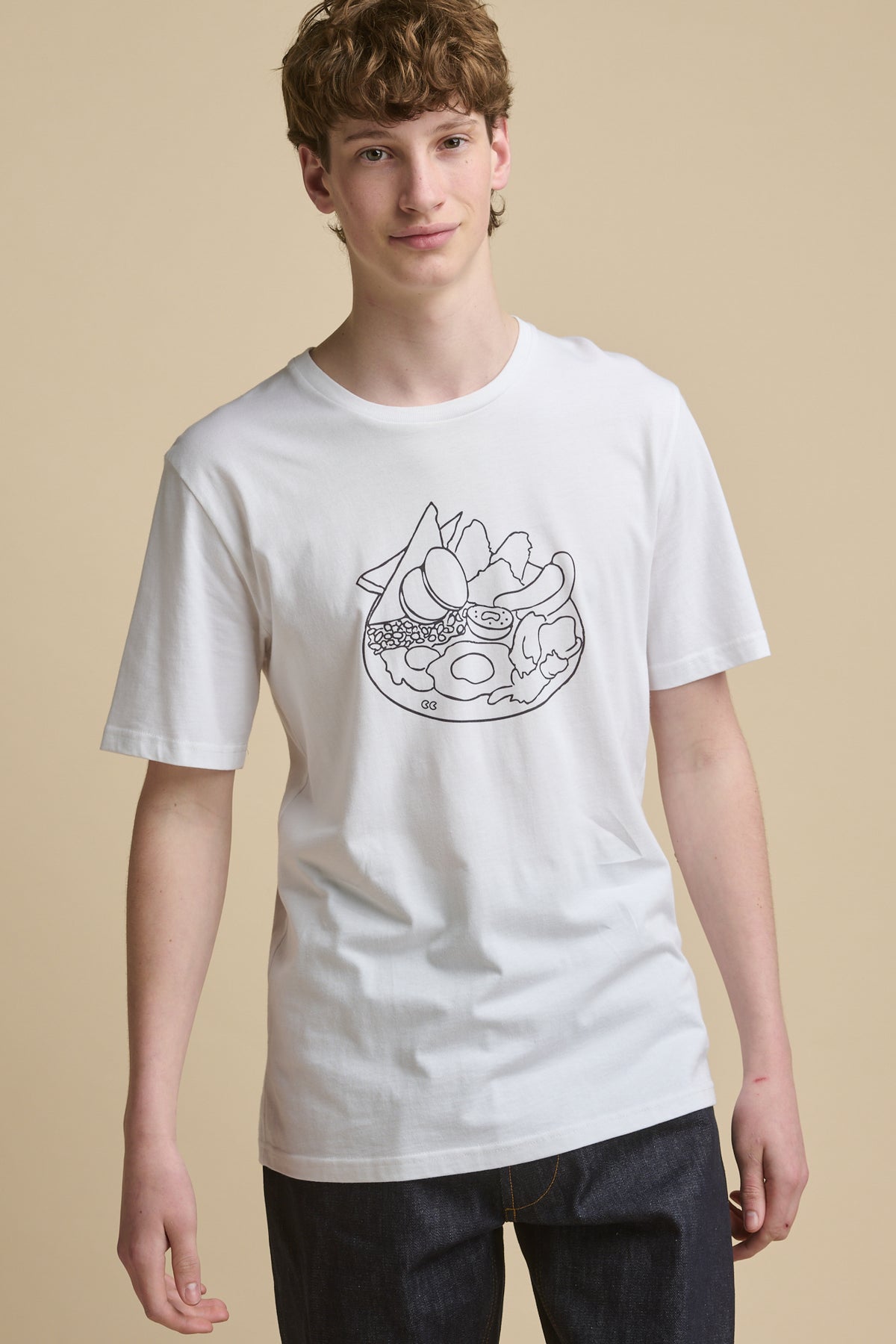 Thigh up front of male wearing short sleeve t shirt with full english print in the centre of the chest
