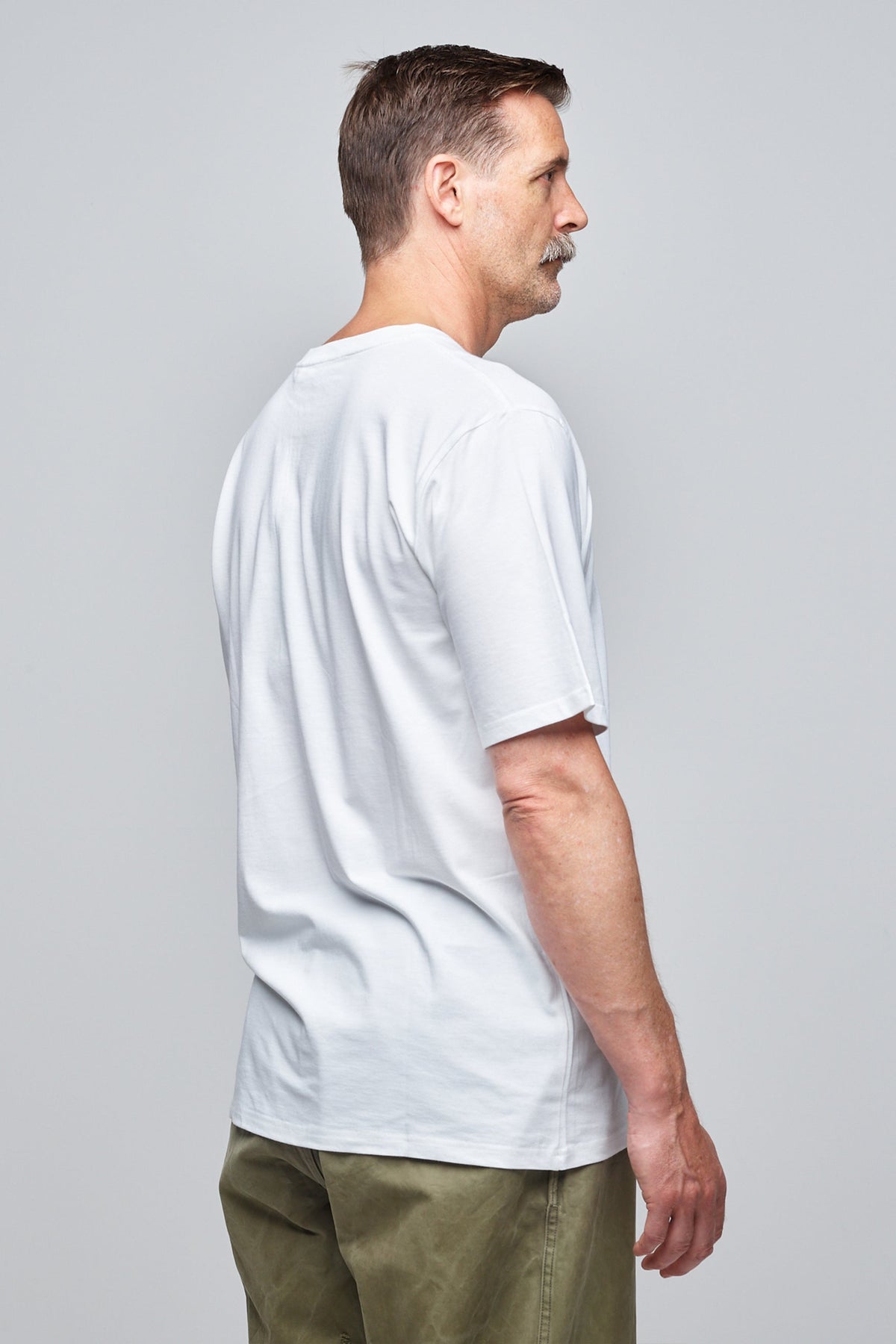 Community Clothing founder, Patrick Grant, wearing a white short sleeve t-shirt.