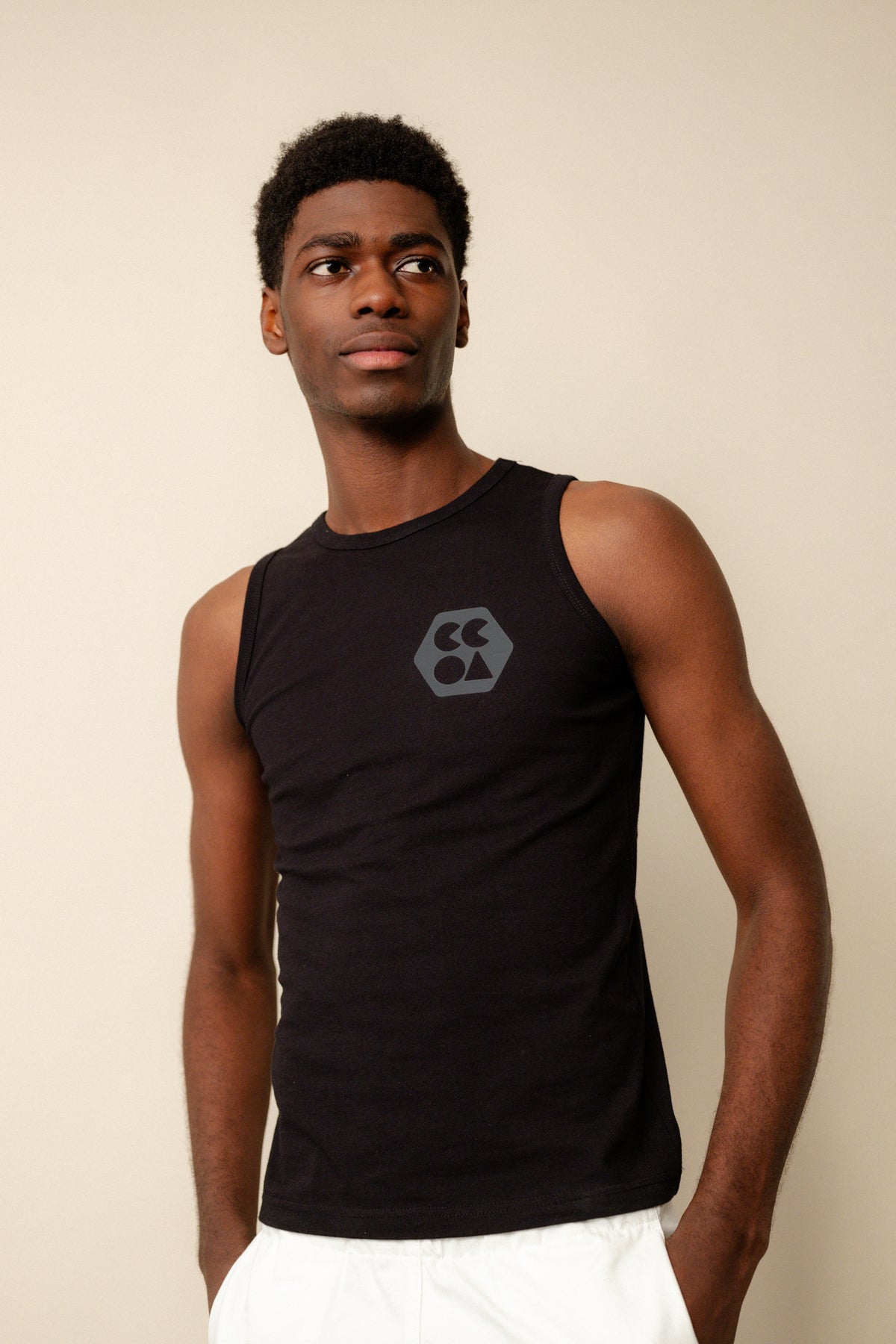 Black male wearing men's sleeveless t shirt plastic free in black