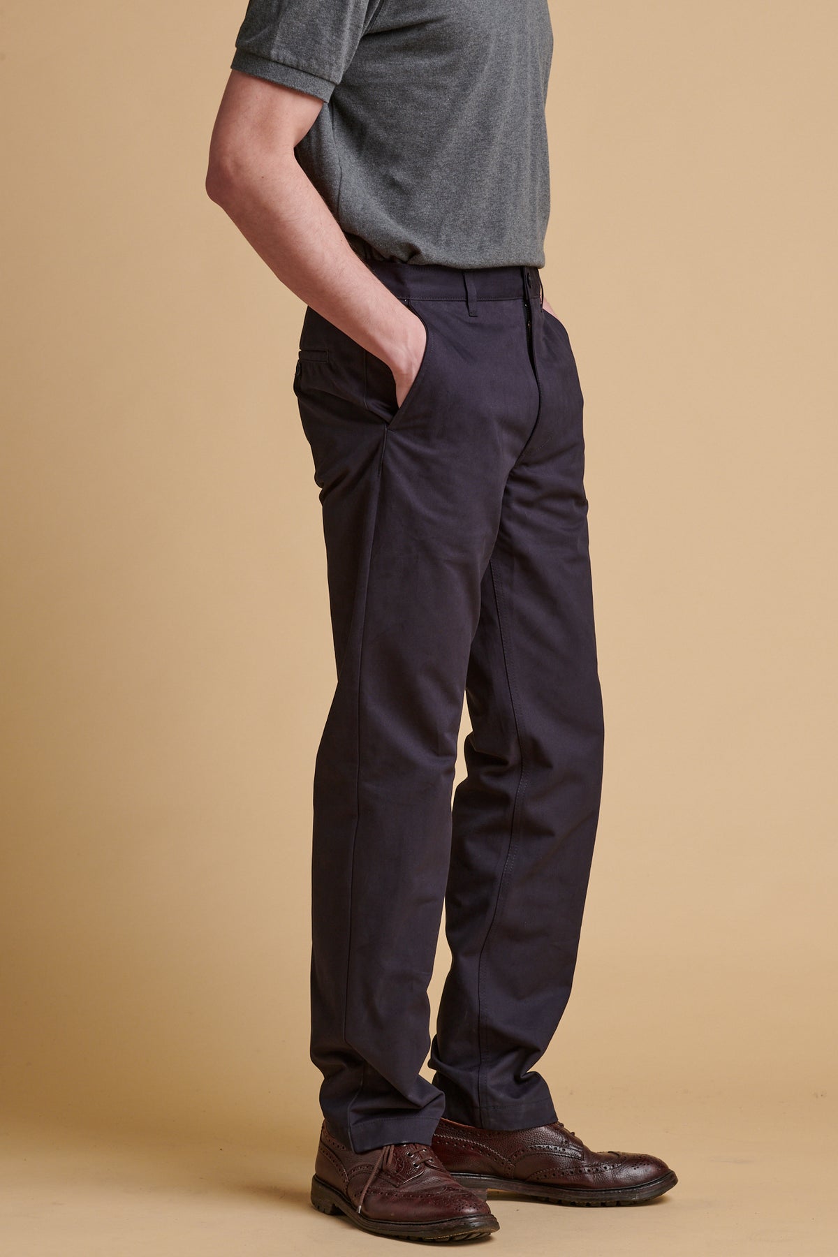 Male wearing slim heavyweight cotton twill chinos in dark navy.