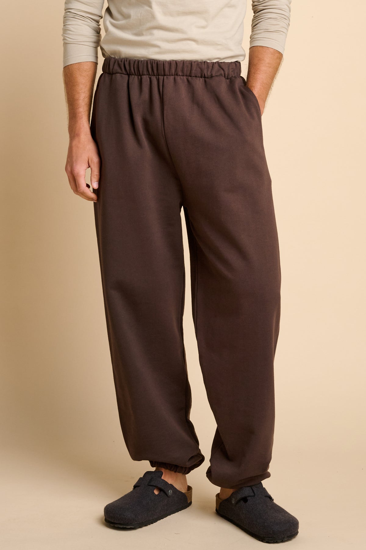 Man wearing chocolate brown sweatpants.