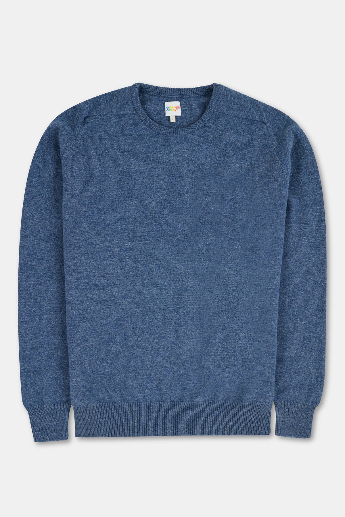 Flatlay of blue lambswool crew neck jumper