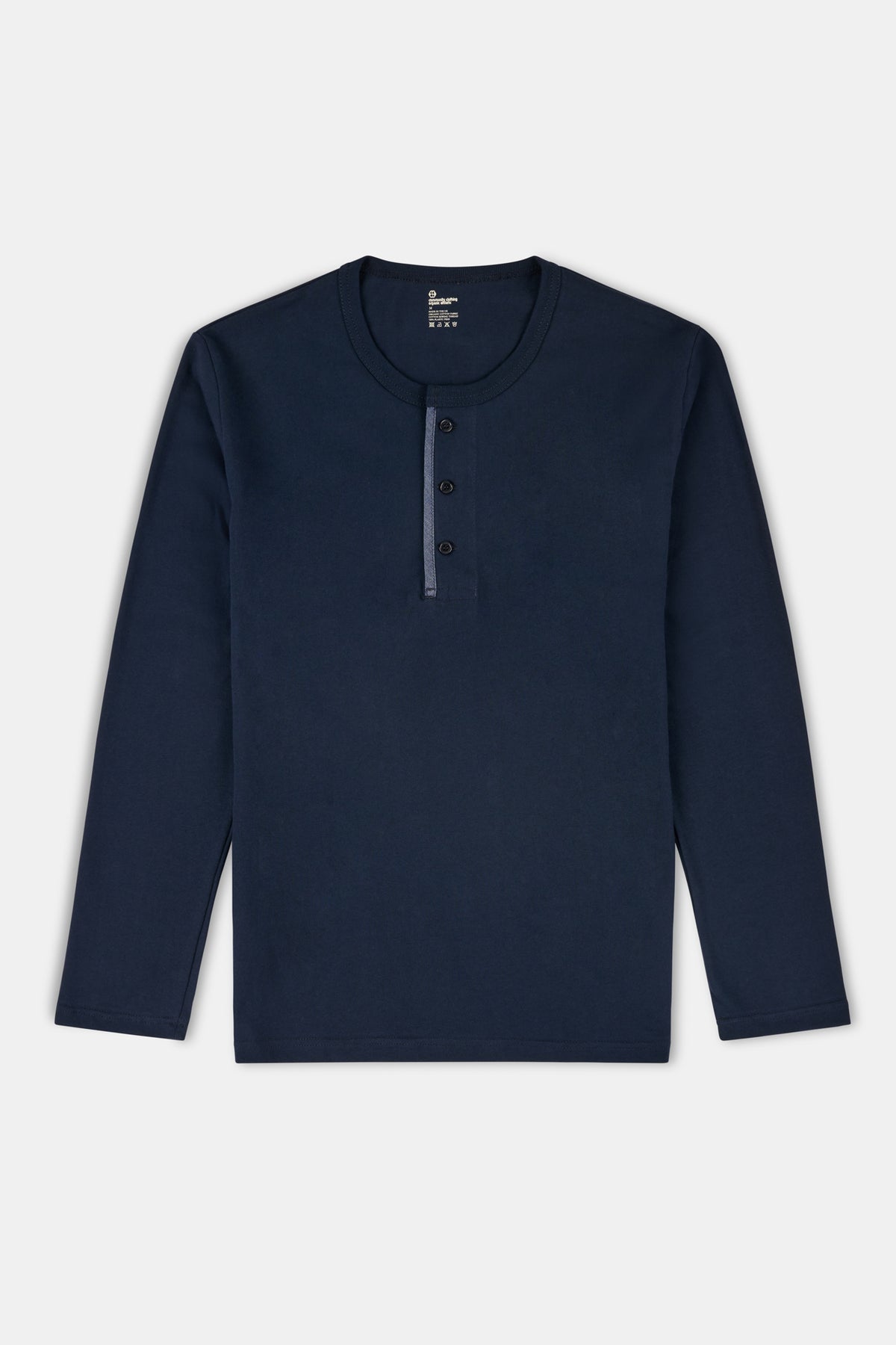 Navy long-sleeve henley top on a light grey background
