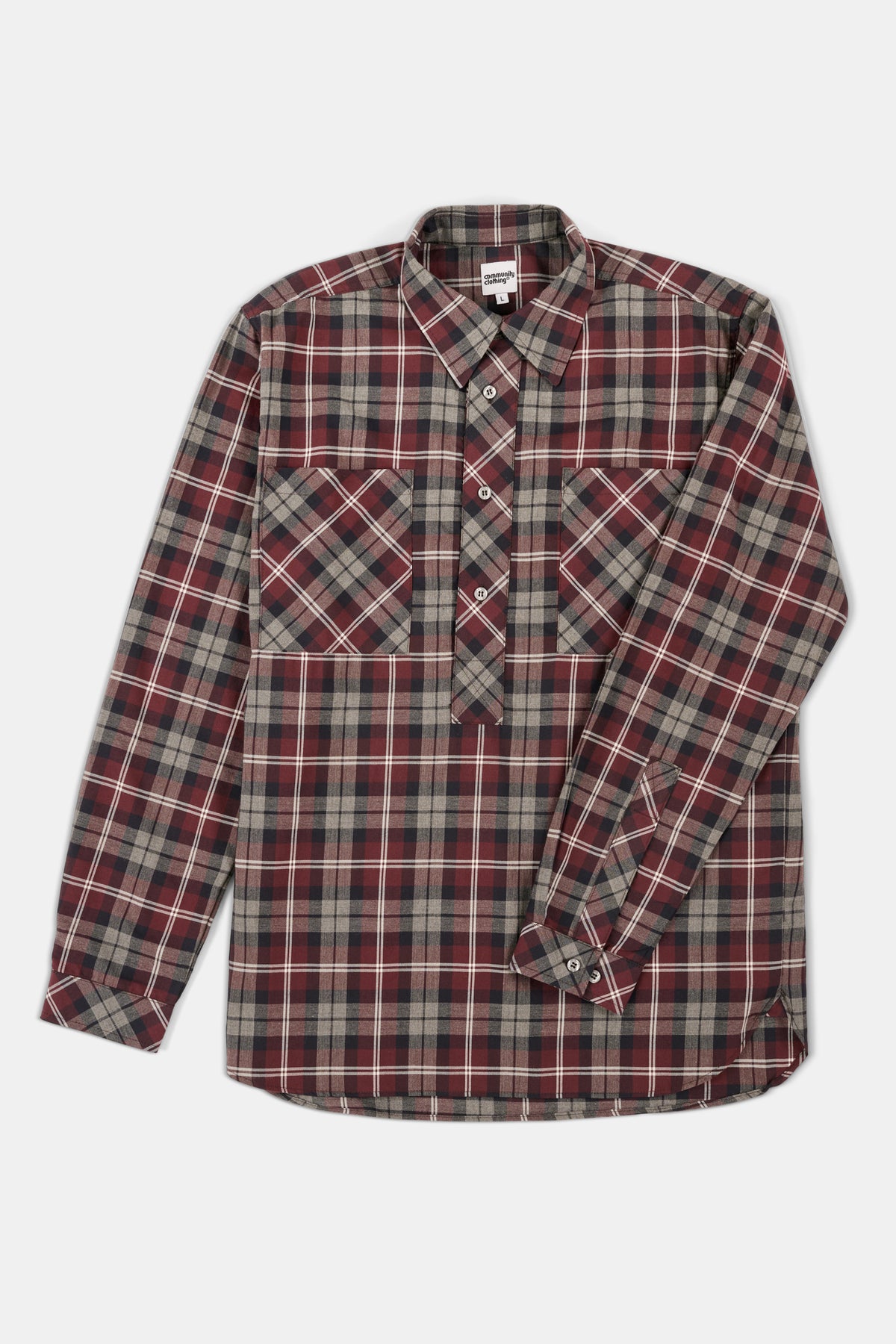 Red and grey check shirt on a white background