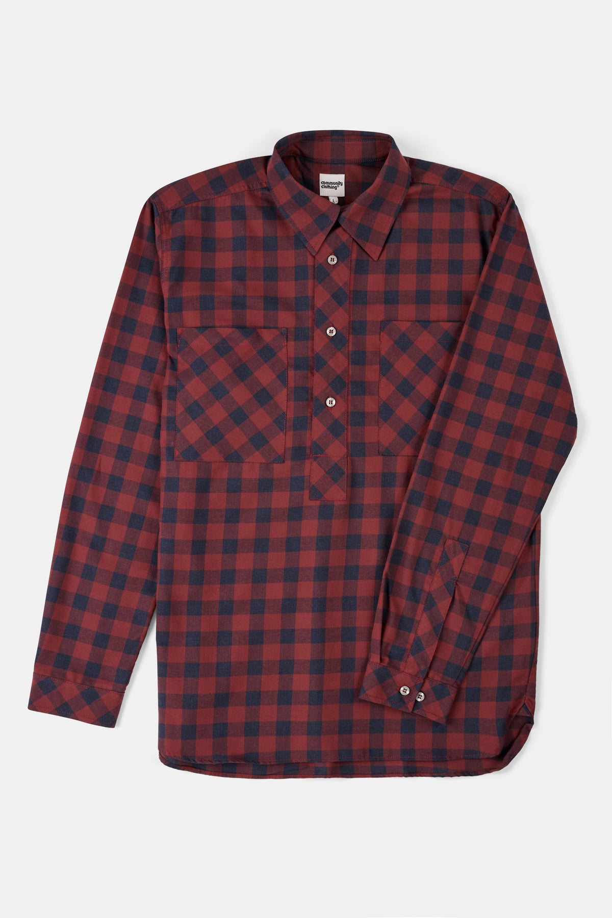 Red and navy plaid shirt on a white background