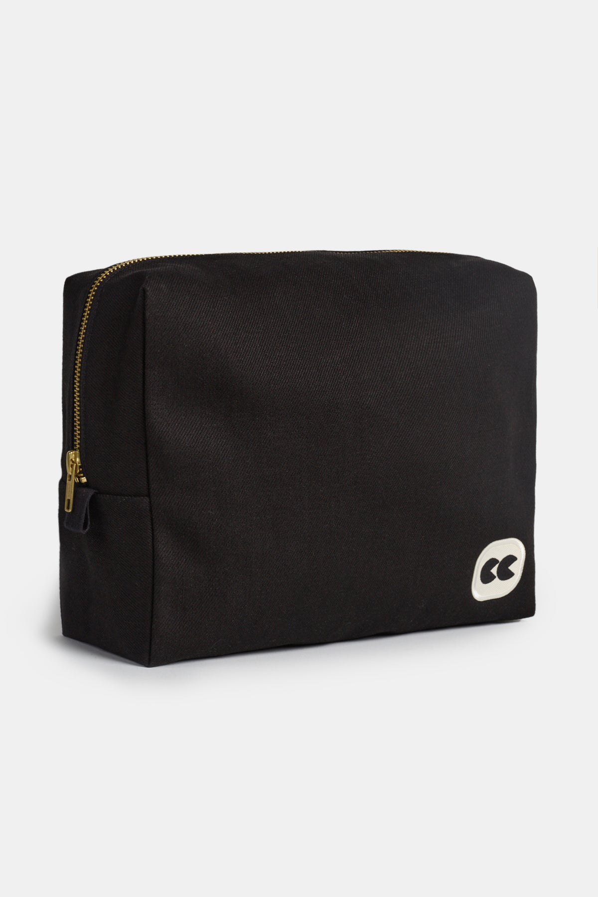 Side of medium sized black pouch showing depth of bag