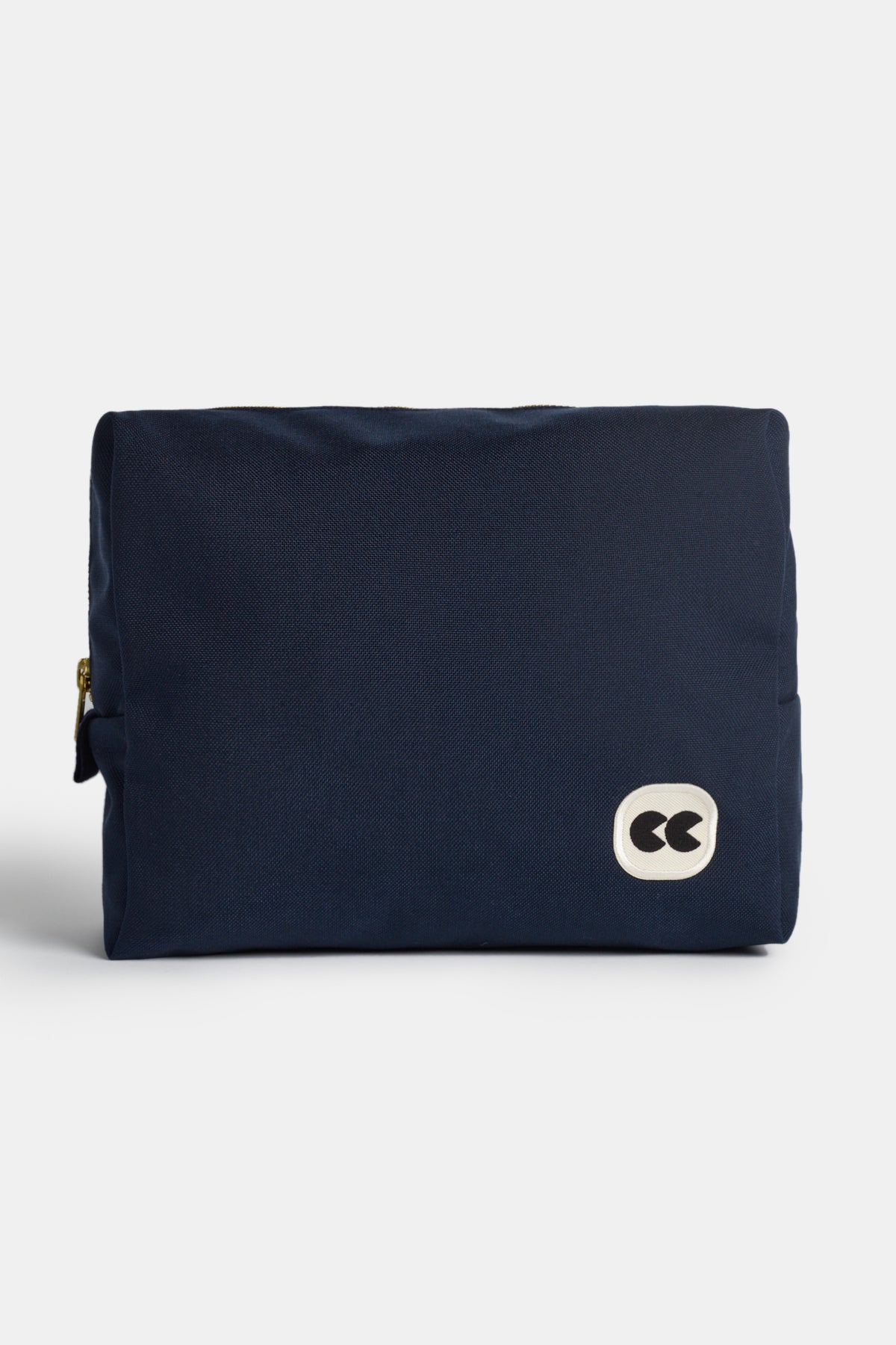 Image showing the front of medium sized pouch in navy. Small CC logo badge on the botton right corner