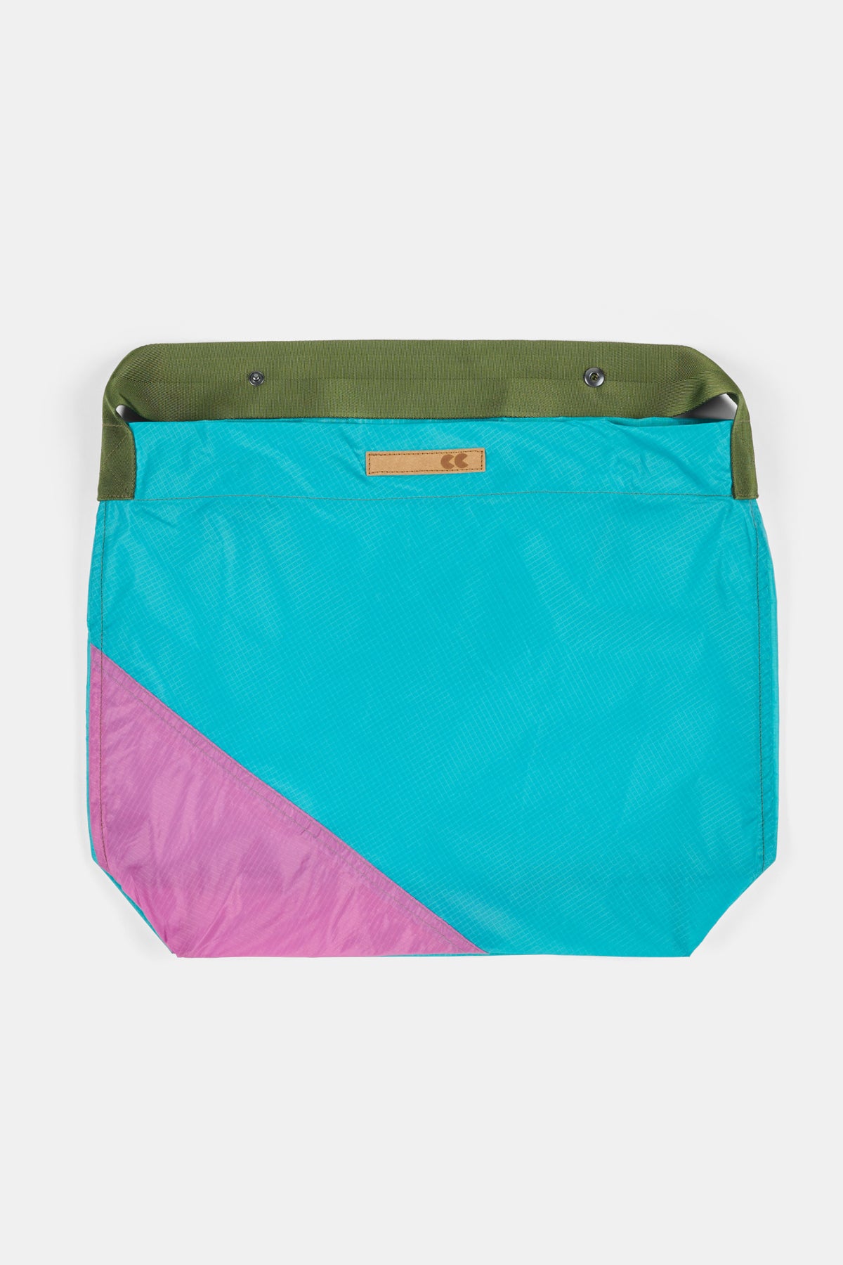 Teal and pink with green strap on a white background.