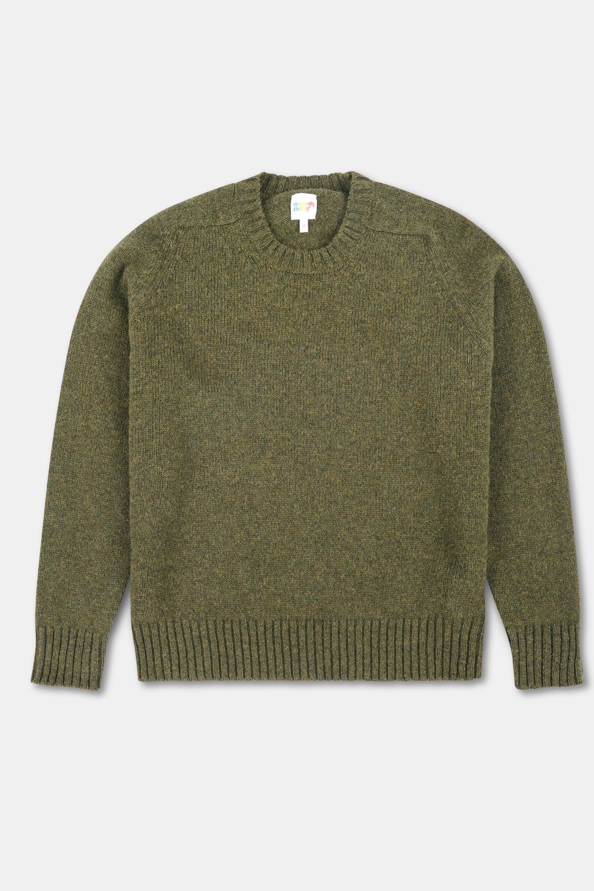 Green sweater on a light gray background