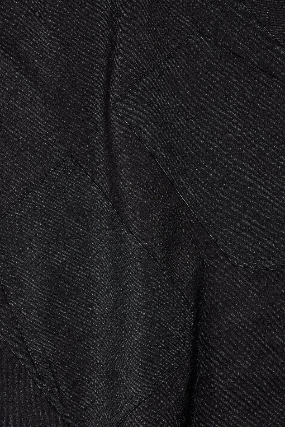 Close-up of lightweight indigo fabric with pockets.