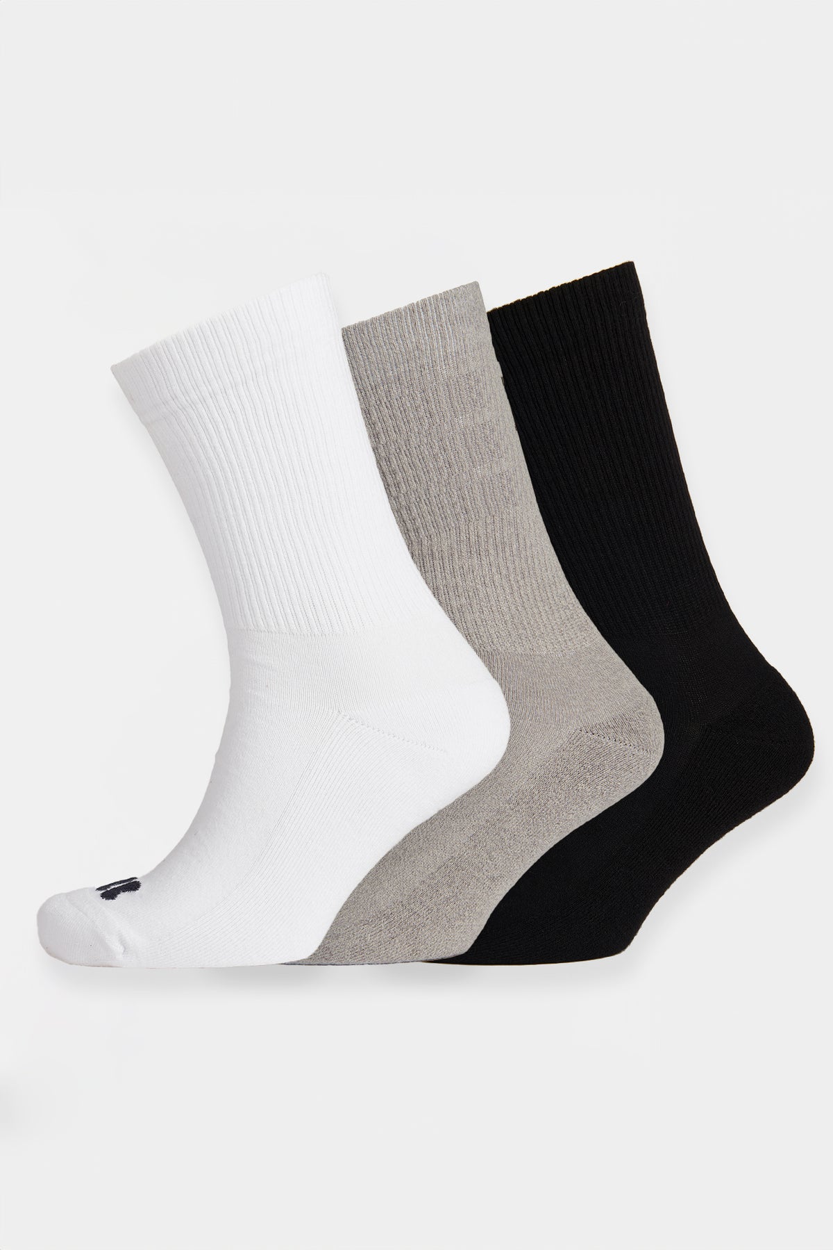 Three pairs of socks in white, gray, and black on a light gray background