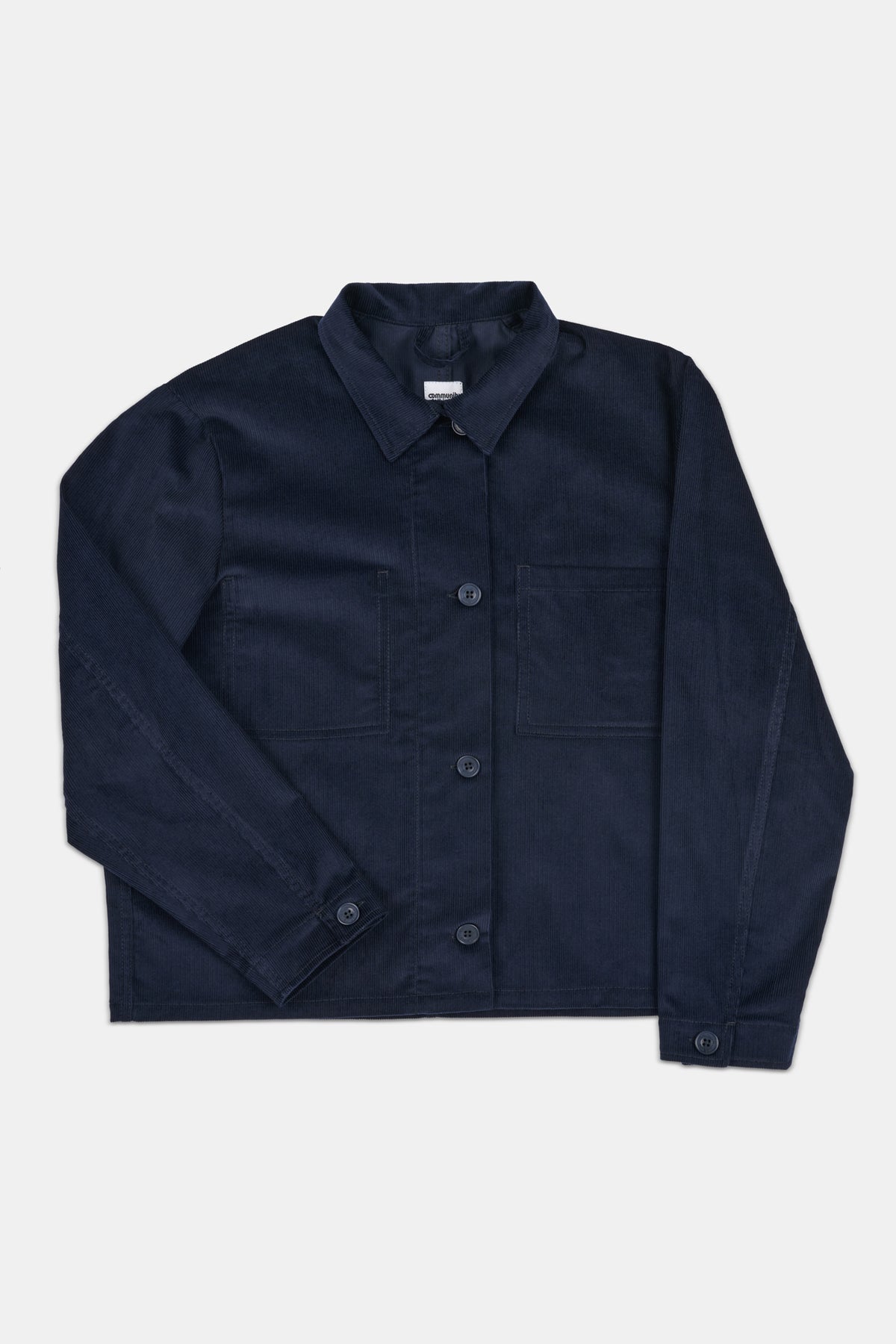 Navy blue corduroy overshirt on white background.