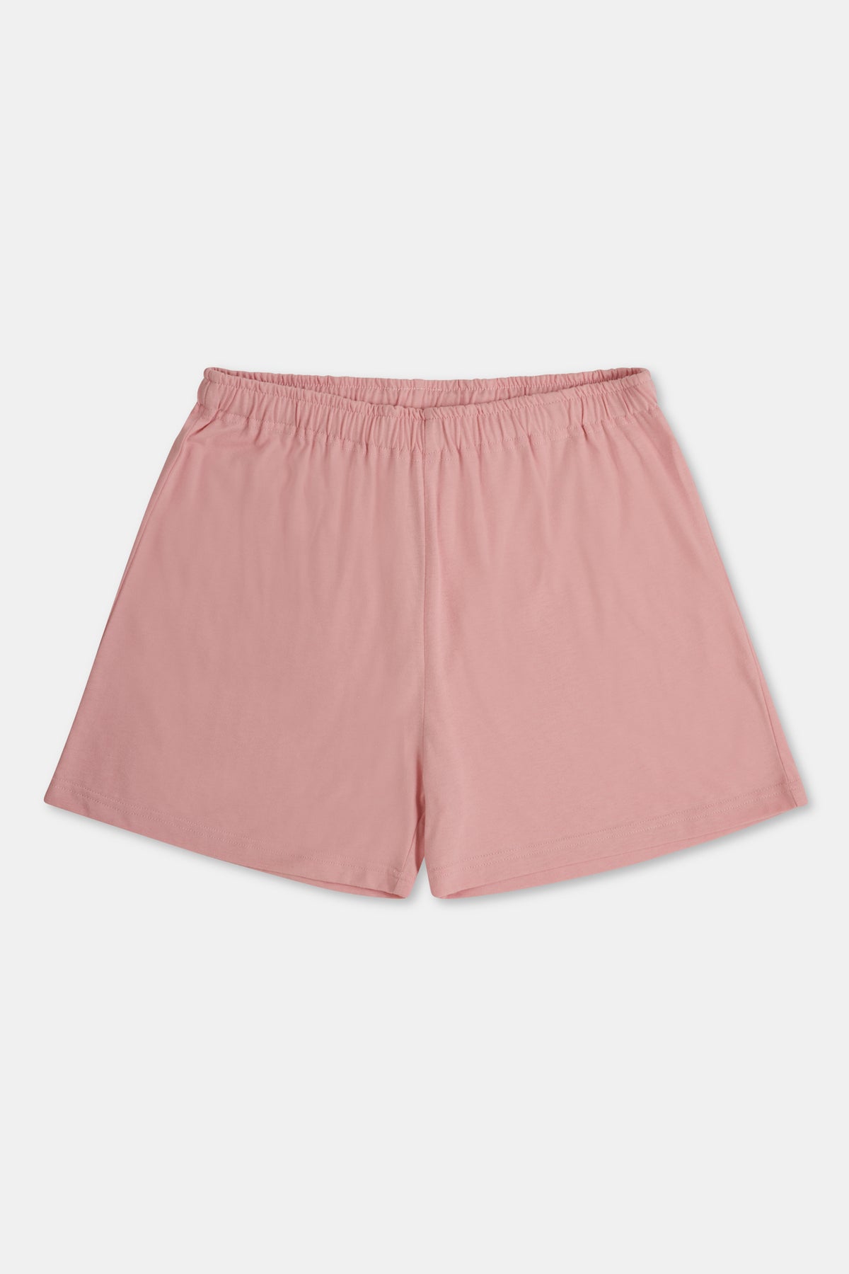 A pair of pale pink jersey shorts with an elastic waistband, shown flat against a plain white background.